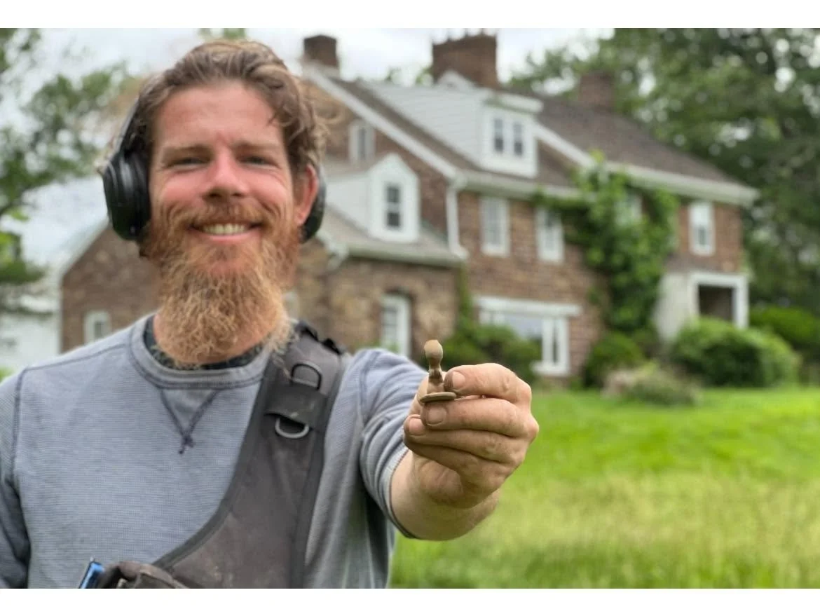 Rich VanWinkle from Quarter Hoarder holding a rare rabbit cigar tamper from metal detecting