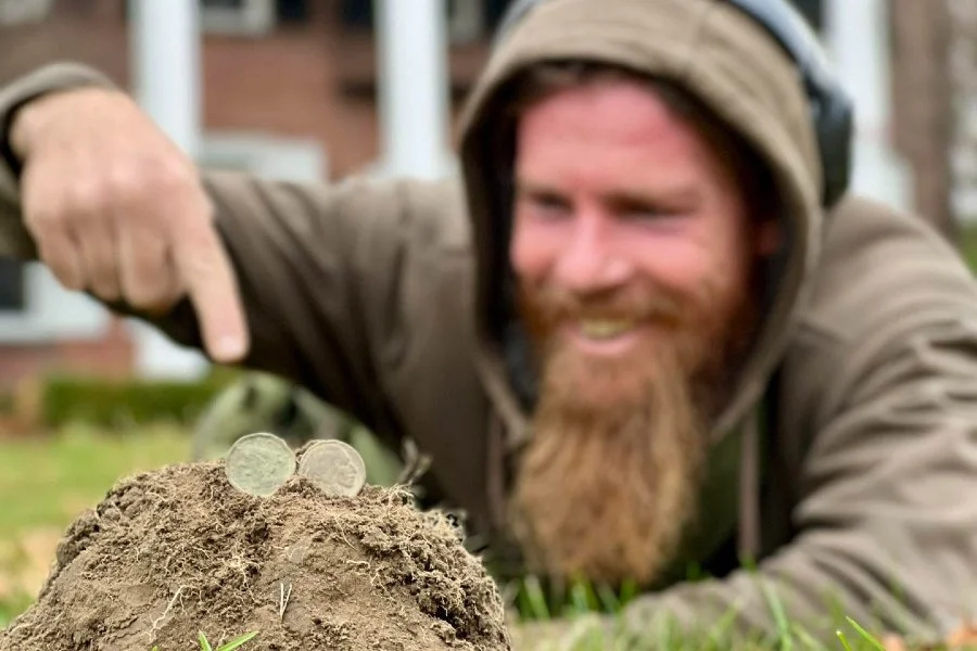 Rich VanWinkle from Quarter Hoarder posing with two U.S large cent coin found metal detecting