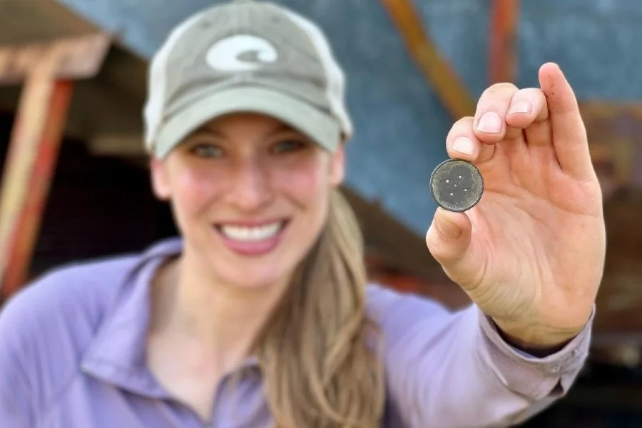 Jessica From Quarter Hoarder Holding a Braided Hair Large Cent That She Found Metal Detecting
