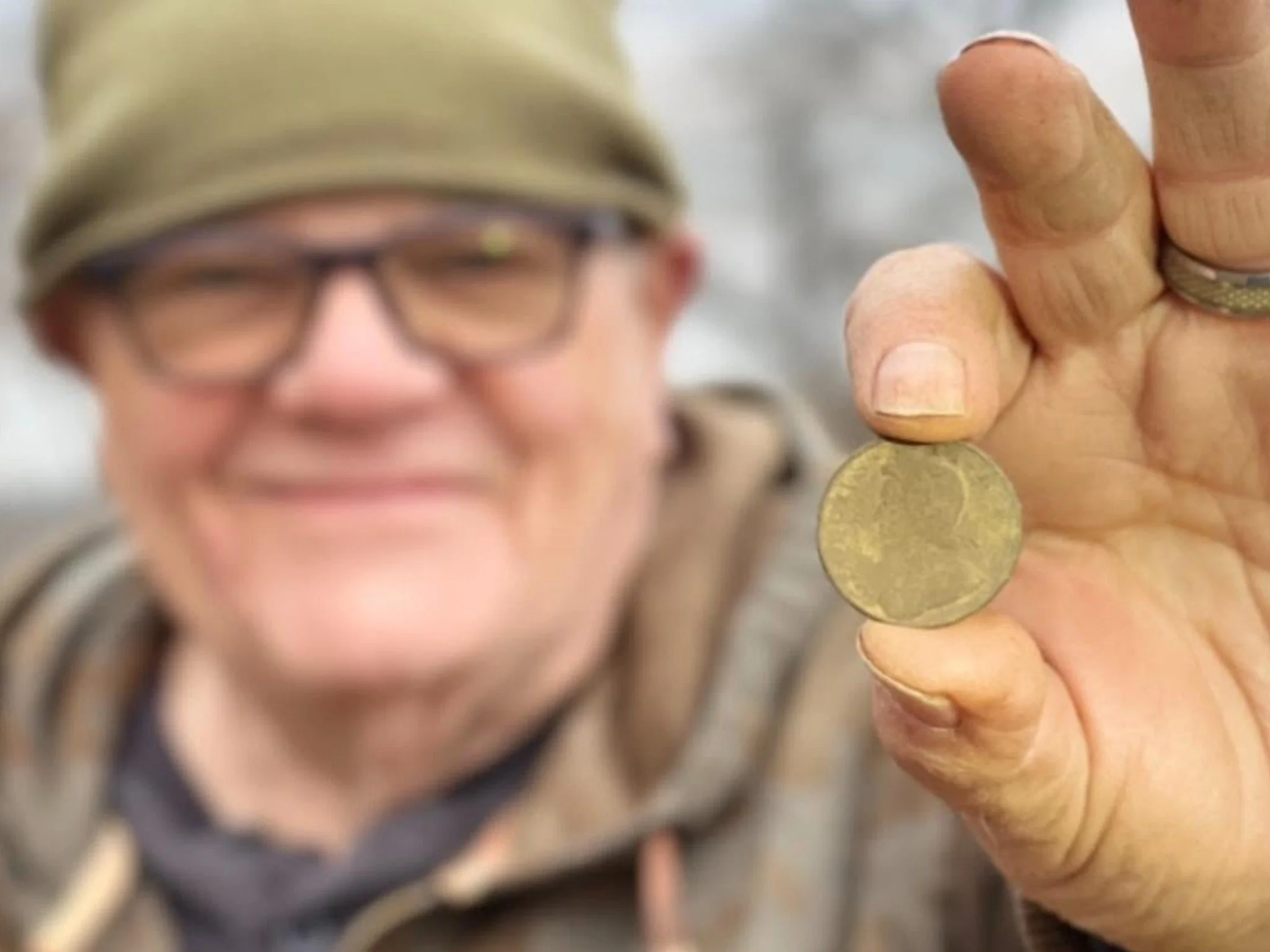 Charley From Quarter Hoarder Holding a King George II Halfpence He Found Metal Detecting