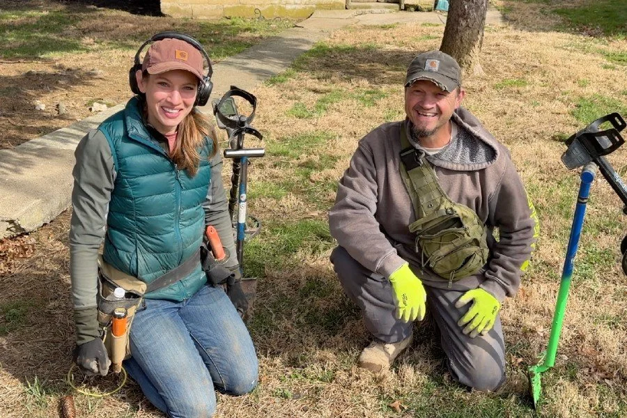 Jessica and Matt from Quarter Hoarder posing with a U.S. large cent found metal detecting