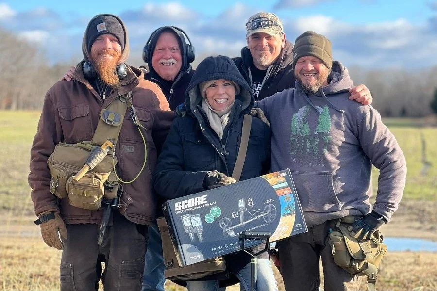 Lynne, Jason, Dogtag Doug, Rich. and, and Matt from Quarter Hoarder holding a new Nokta Triple Score metal detector in the box