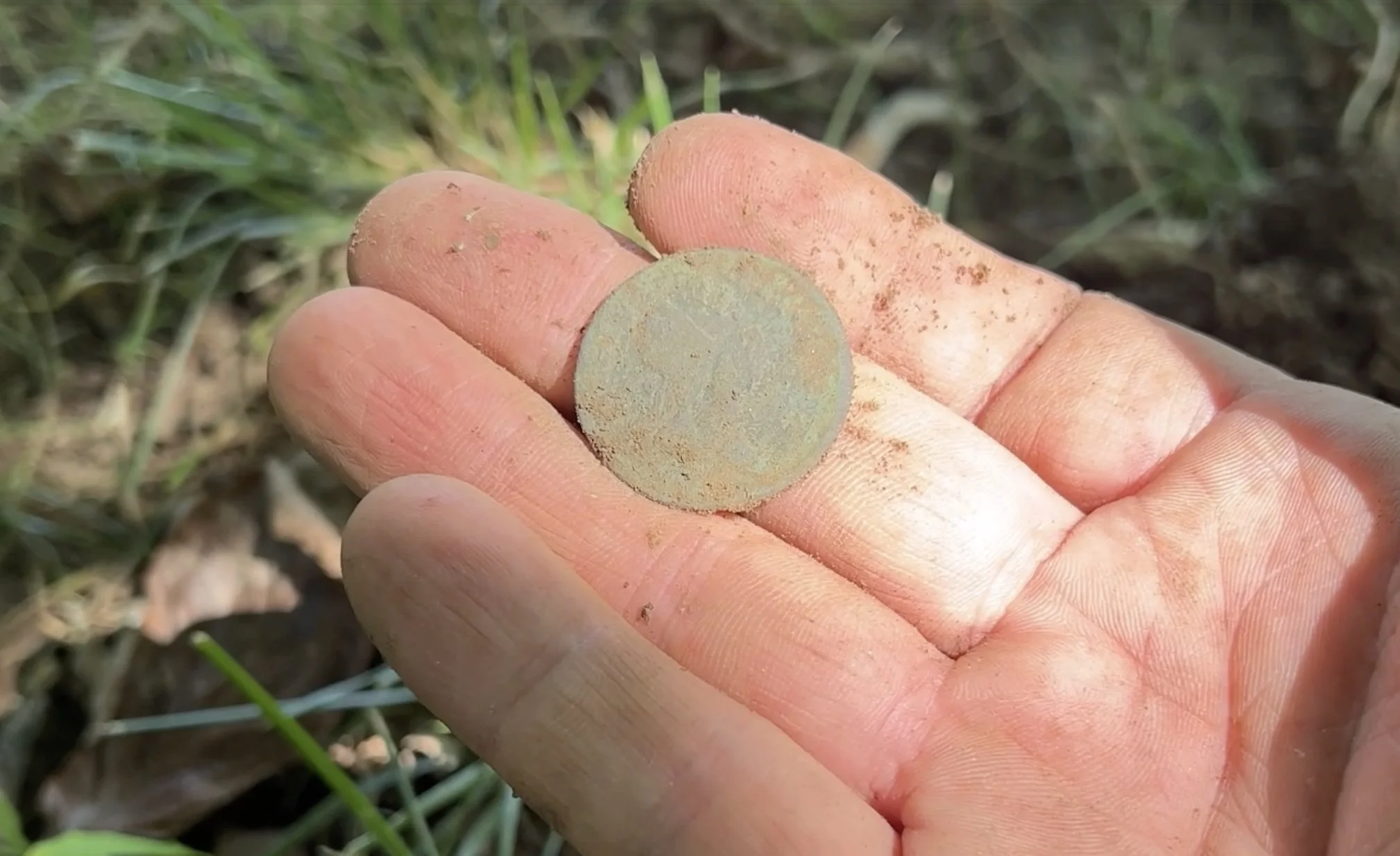 Freshly dug 1769 Hibernia halfpenny found metal detecting at a colonial home