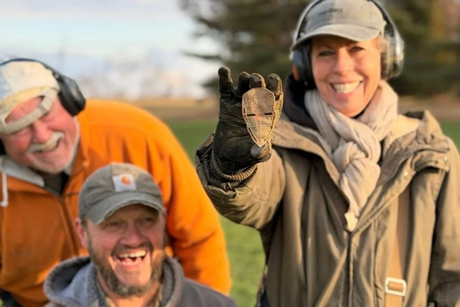 Lynne, Dogtag Doug, and Matt from Quarter Hoarder holding a 1940's car radiator emblem found metal detecting