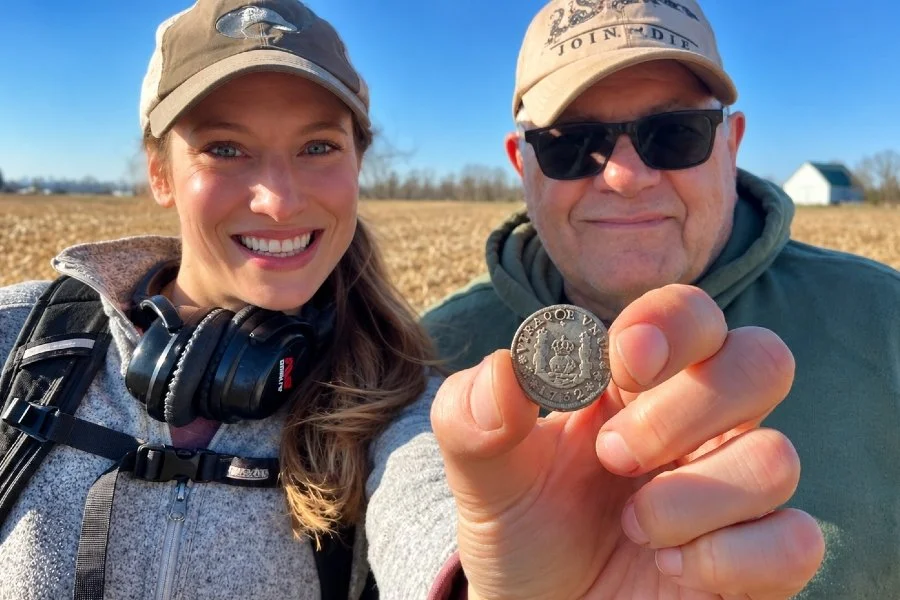 Jessica and Charley from Quarter Hoarder Holding a Spanish Silver One Reales Coin