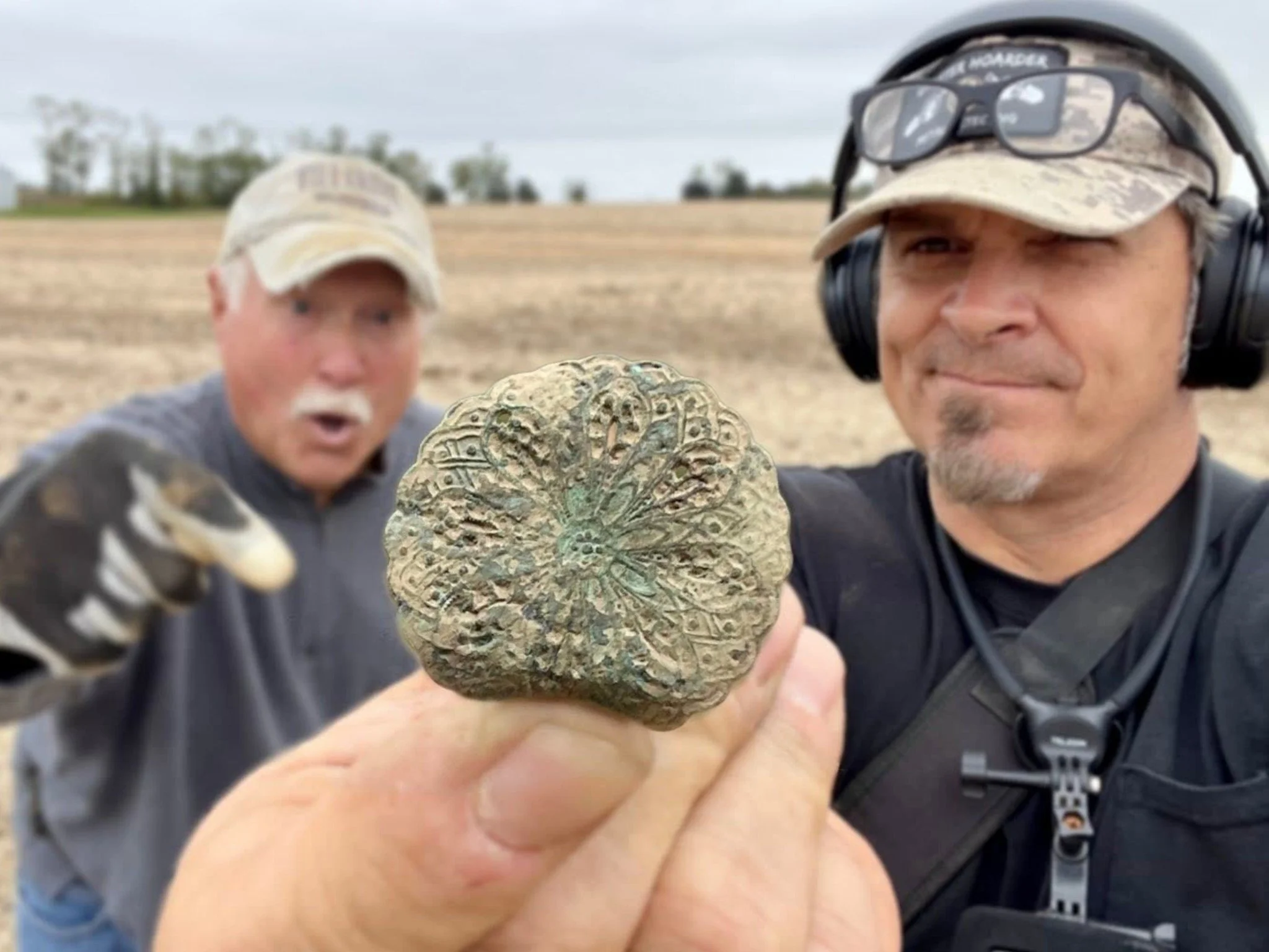 Jason Quarter Hoarder Holding a Large Fancy Dandy Button