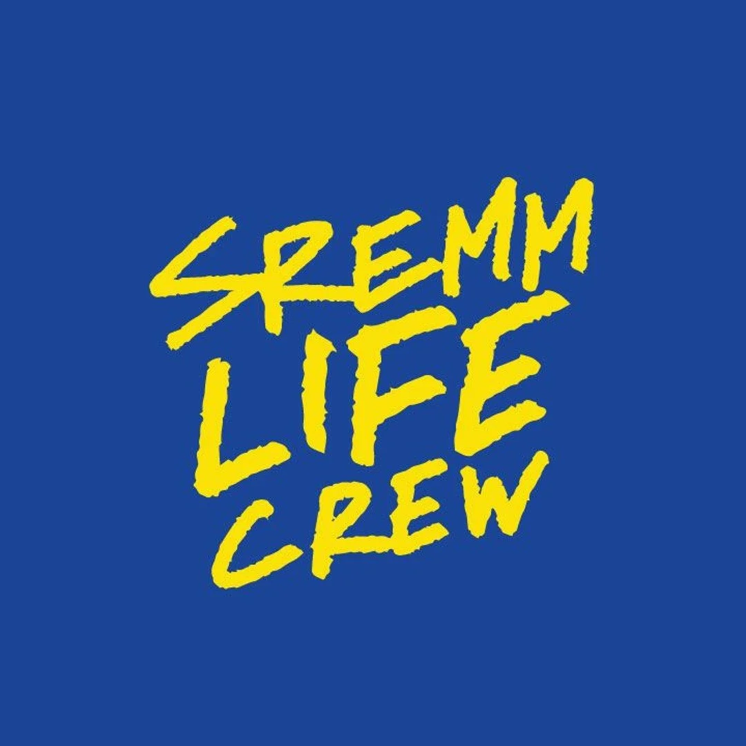 Blue background with the text 'SREMM LIFE CREW' written in yellow, stylized, uneven handwriting style.