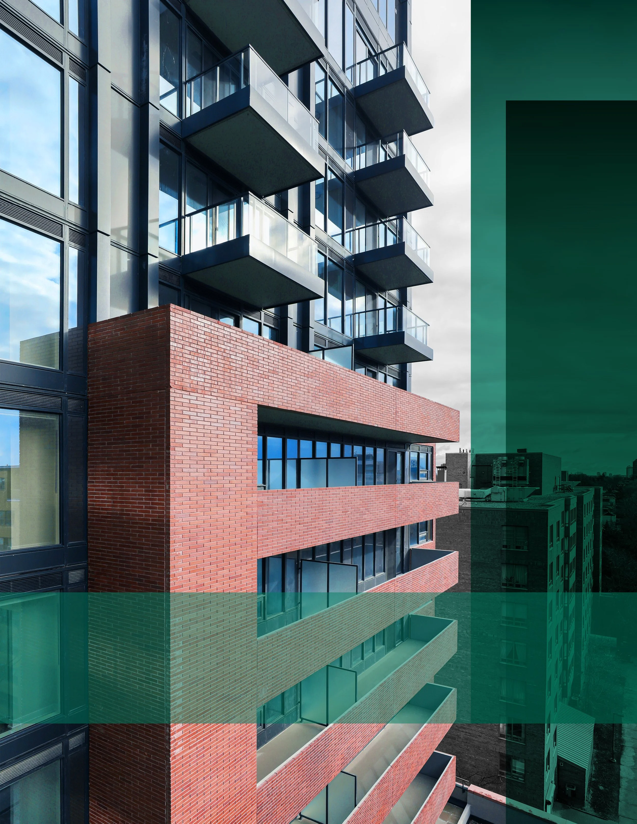 Residential building at 2525 Bathurst Street, Toronto, with brick and glass exterior and glass balcony railings