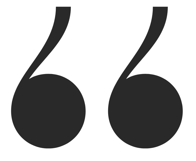 Close-up of a pair of black quotation mark symbols