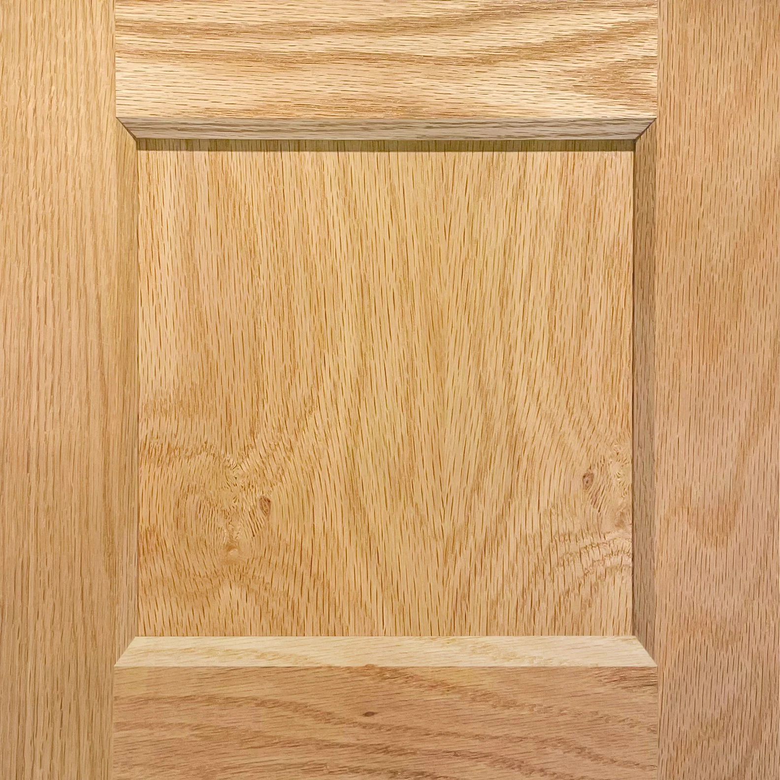 A close-up view of a wooden cabinet or drawer with visible wood grain and a rectangular open space or compartment.
