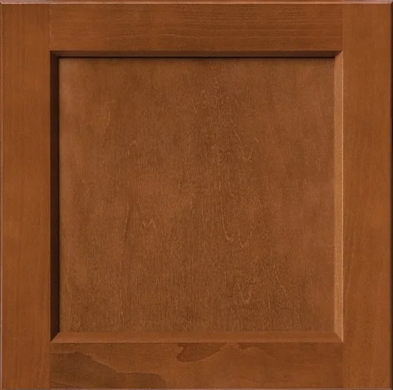 A wooden cabinet door with a recessed panel design.