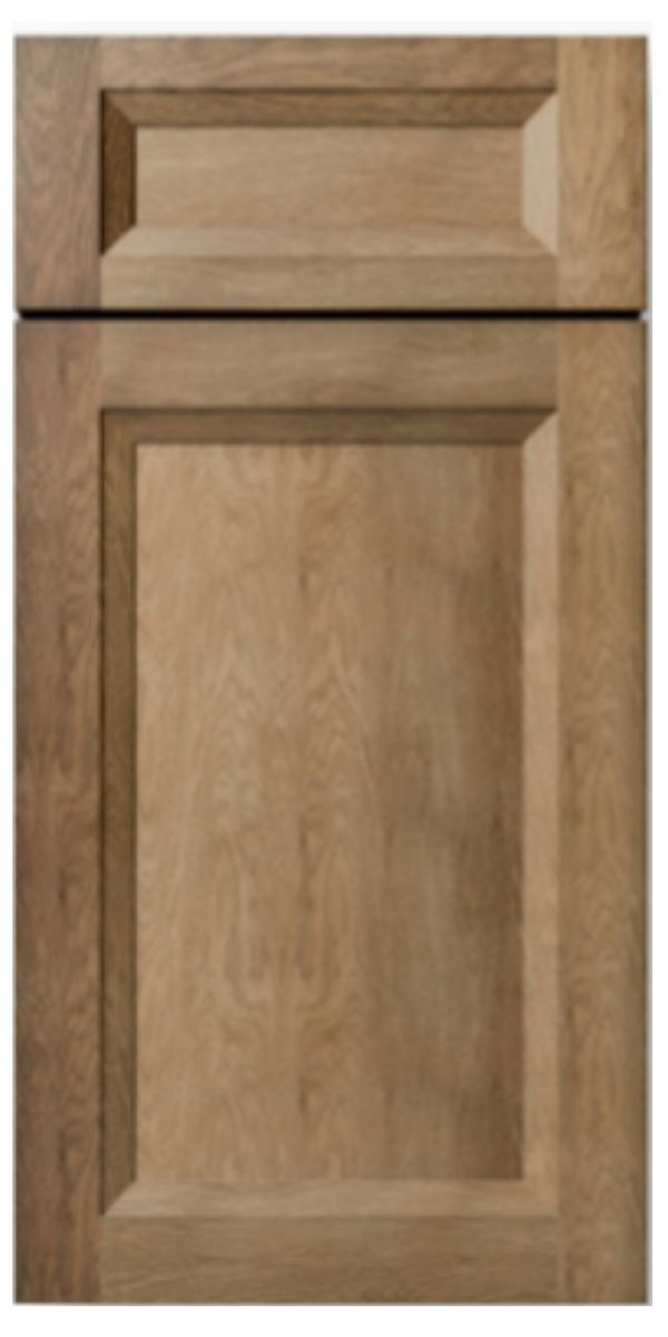 Close-up of a wooden cabinet door with a rectangular recessed panel and a natural finish.