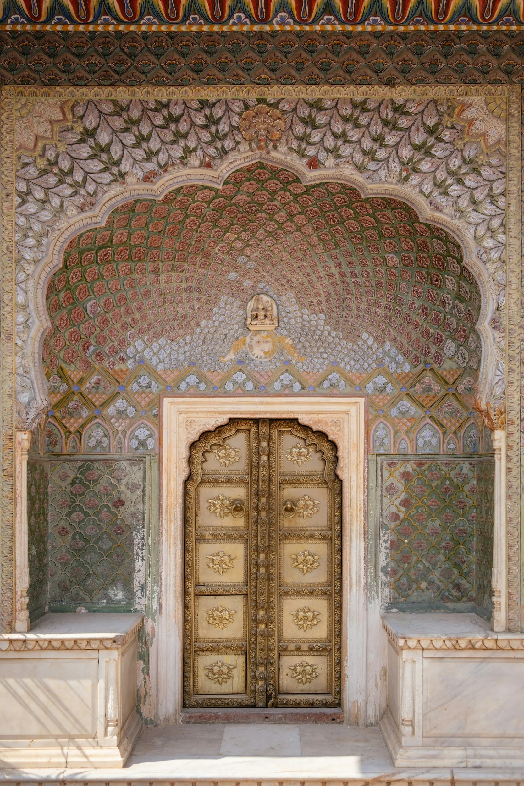 Contact page: Ornately decorated doorway at an Indian heritage property