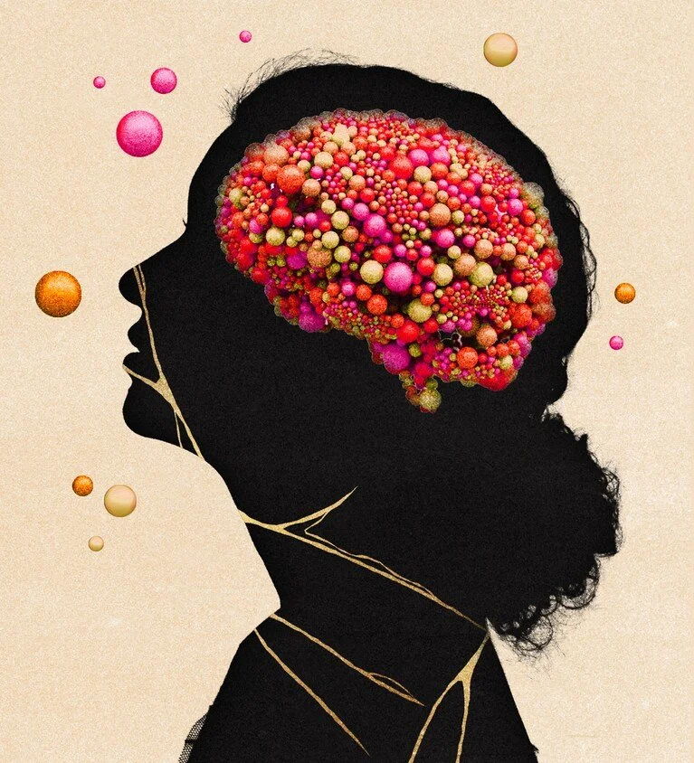 Silhouette of a woman with a colorful brain made of pink, orange, and yellow spheres inside her head, with floating spheres around her.