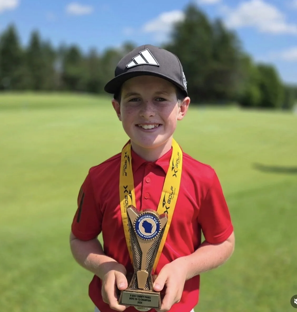 Andrew Tomaszewski with his Wisconsin Junior PGA trophy