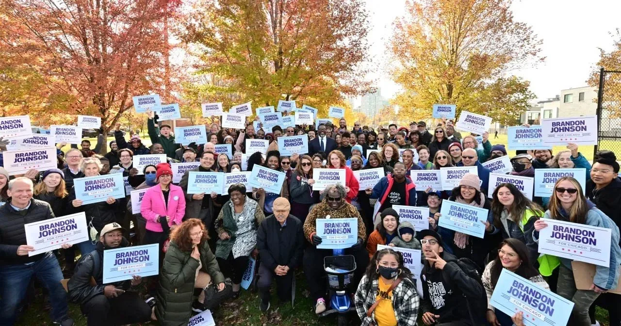 Photo of Chicago Mayor Brandon Johnson, who is running for reelection, with members of Team Johnson