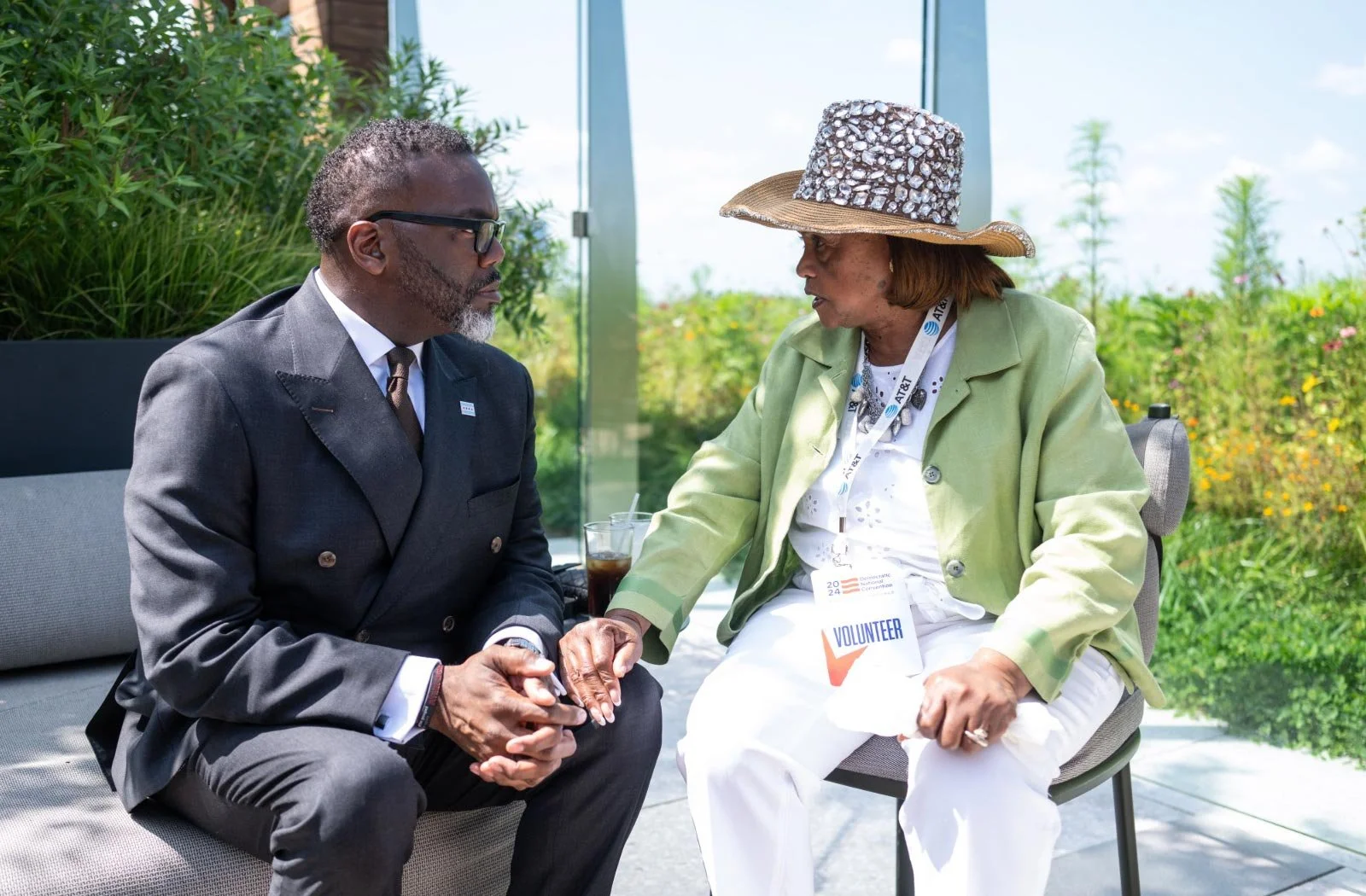 Photo of Chicago Mayor Brandon Johnson, who is running for reelection, talking with a constituent
