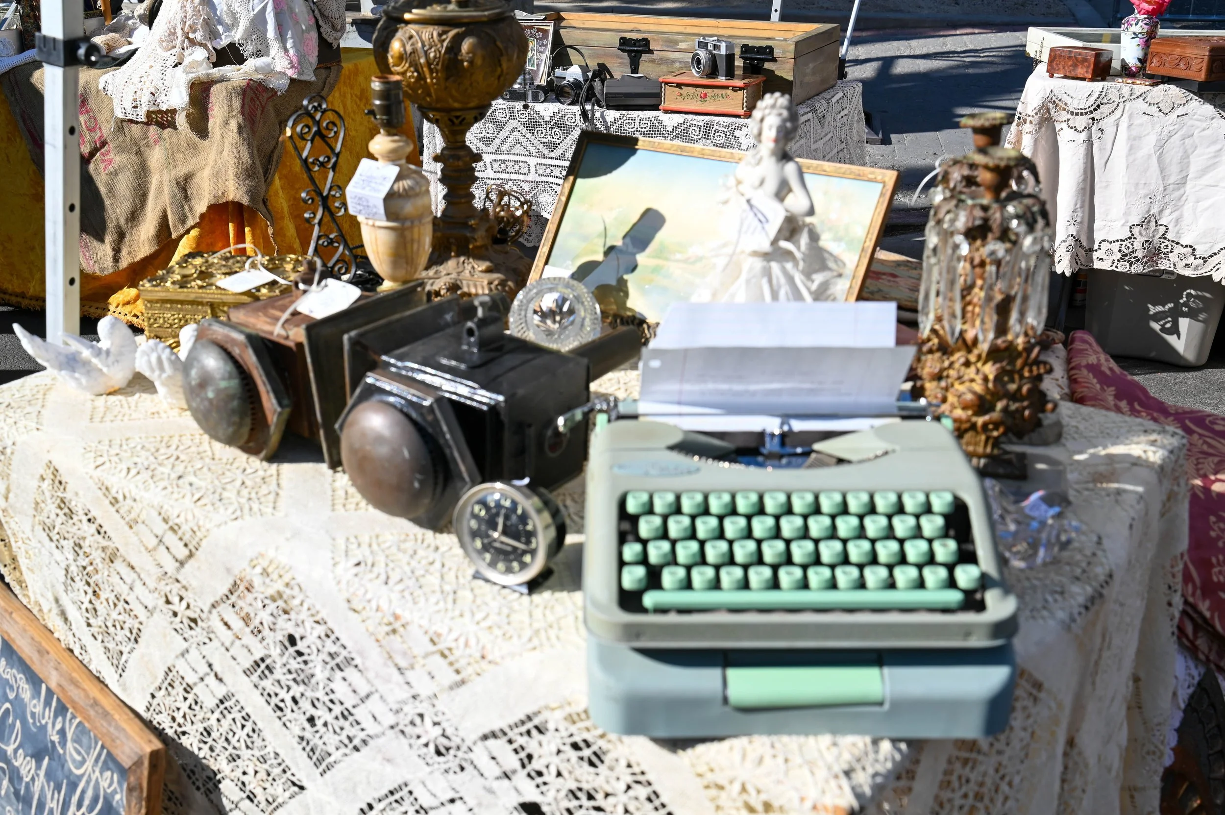 An old typewriter and decorative pieces show how everyday items from the past can become collectibles years later.