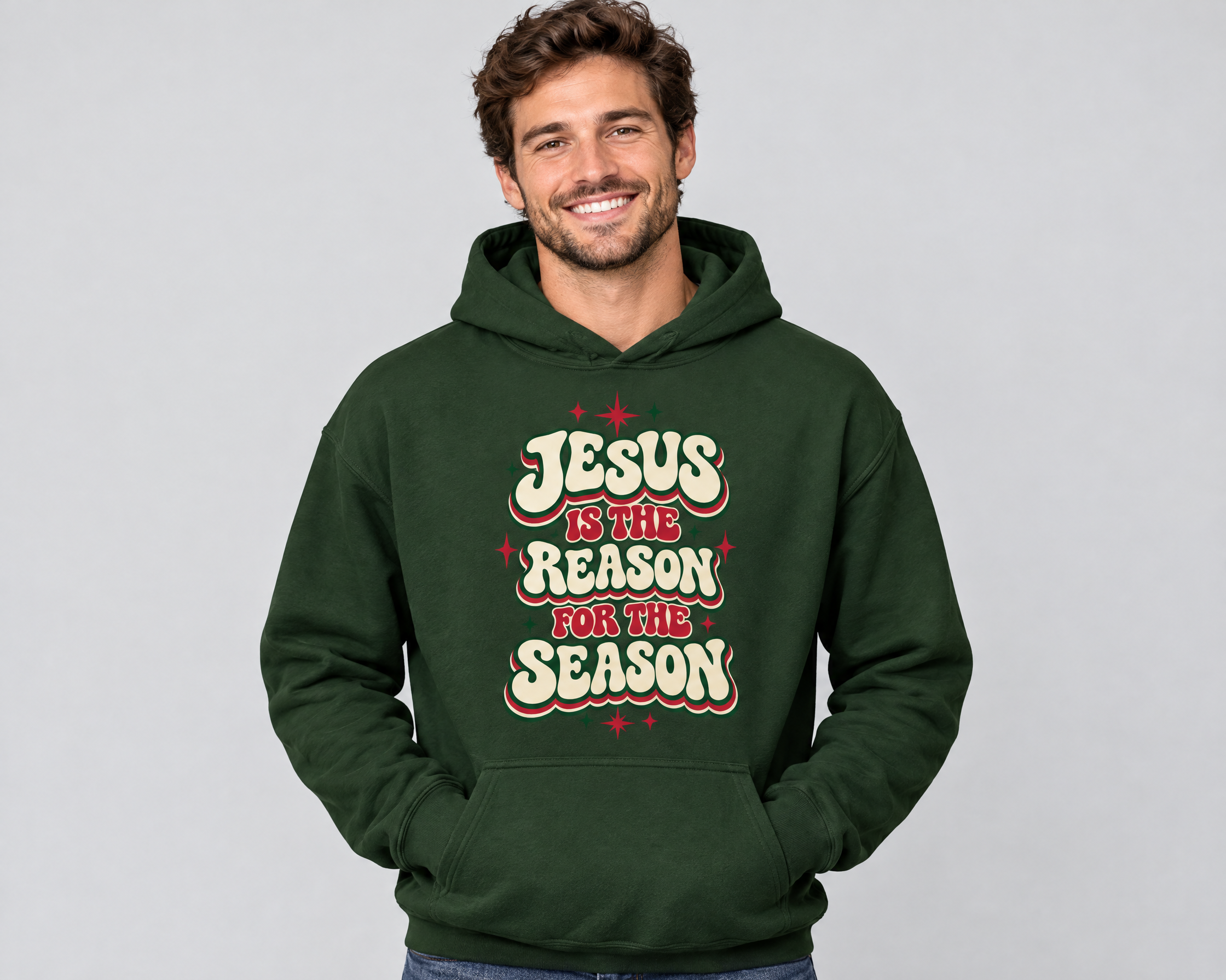 Man wearing the Jesus Is the Reason for the Season Christmas Hoodie in forest green