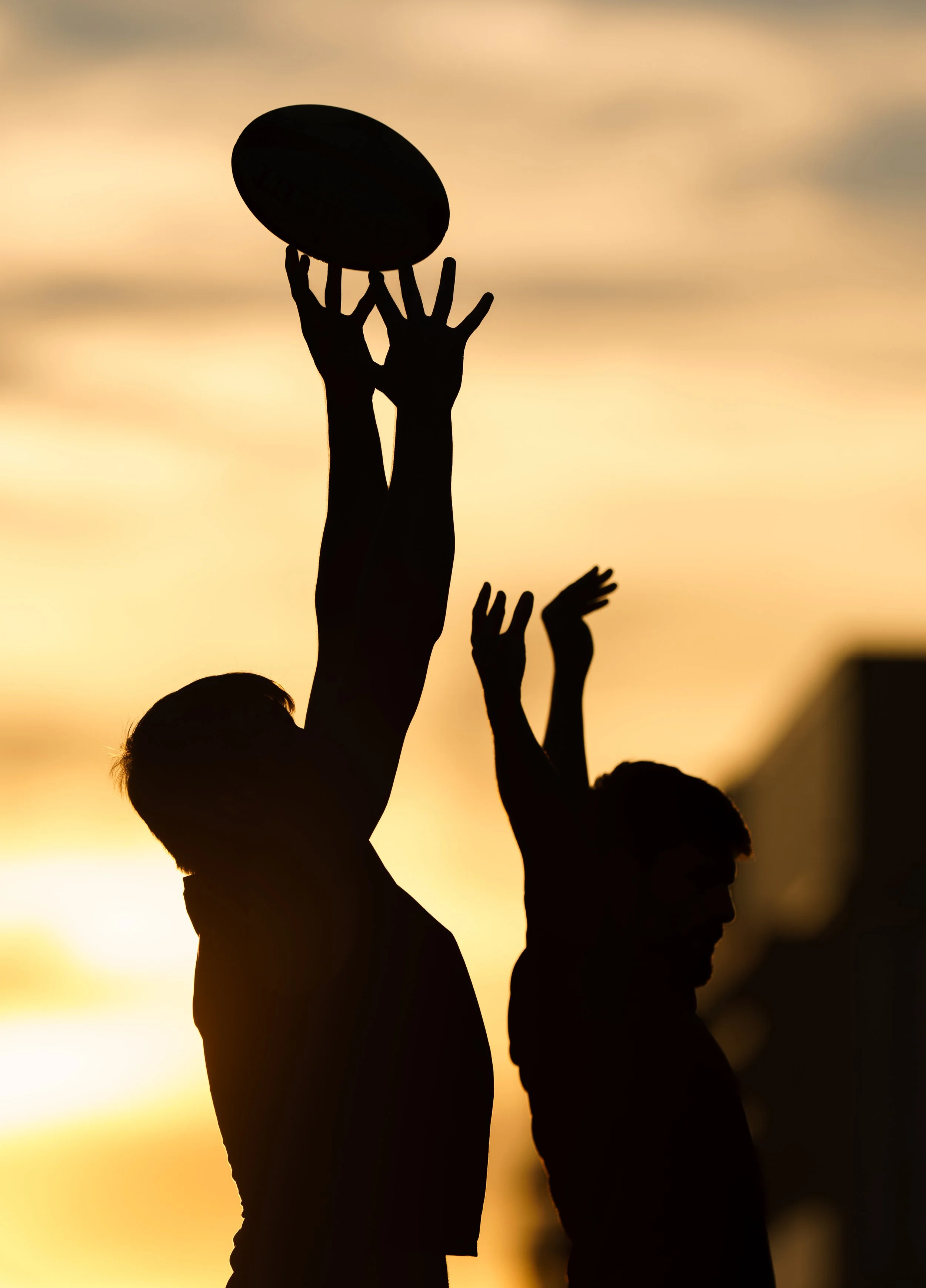 Rochester Institute of Technology students on the men’s club rugby team are lifted by their teammates to practice lineouts on the RIT Turf Field on Sept. 17, 2025, in Rochester, N.Y. 