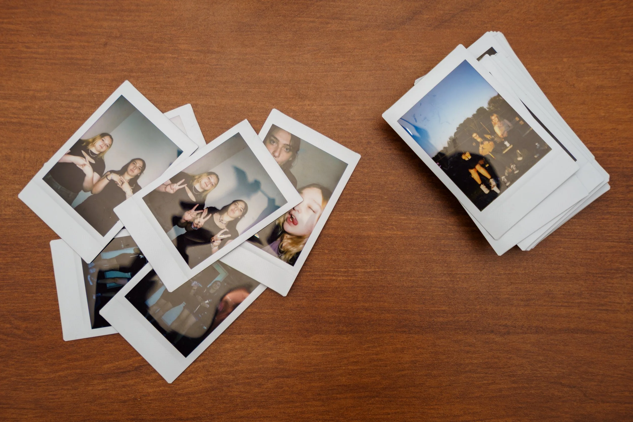A detail image showing several polaroid photos of Madi and Alicia Gentes together taken over several years that Alicia keeps in her apartment at Rochester Institute of Technology on Apr. 20, 2025 in Rochester, N.Y.
