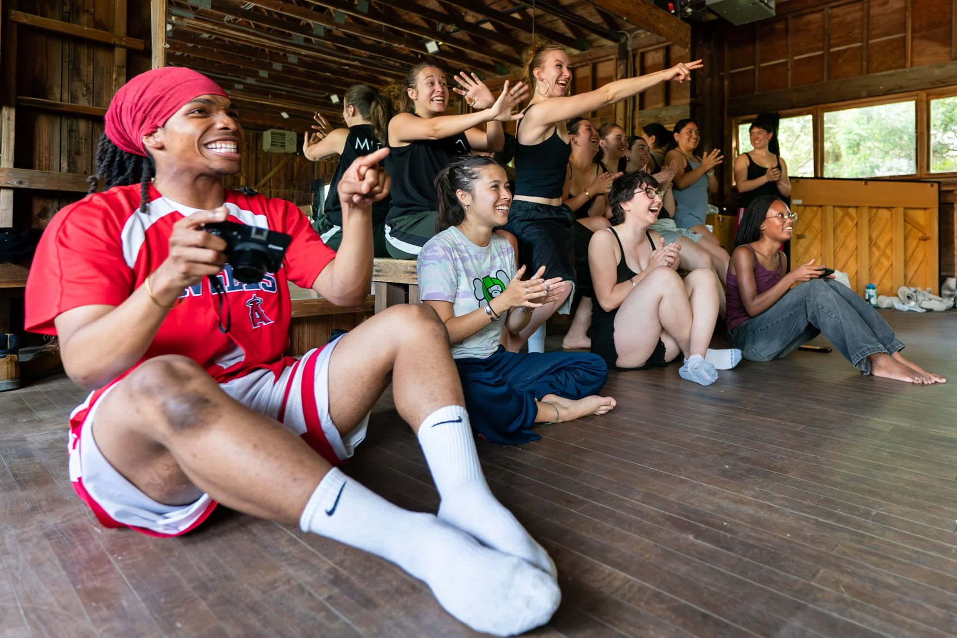 Interns cheer each other on while watching their structured improvisational pieces during “Interns Make A Dance,” a class taught by Dawn Lane on June 6, 2026.