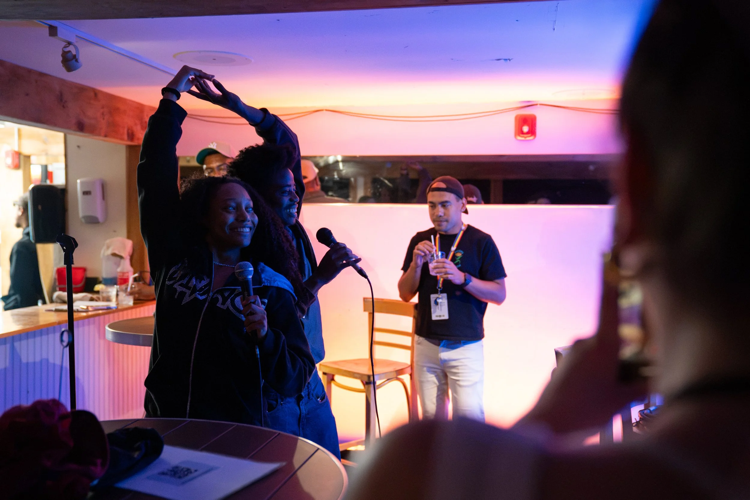 (From left) Aaryn Coleman and Eden Arzu perform karaoke together during Post at The Pub on July 30, 2026.