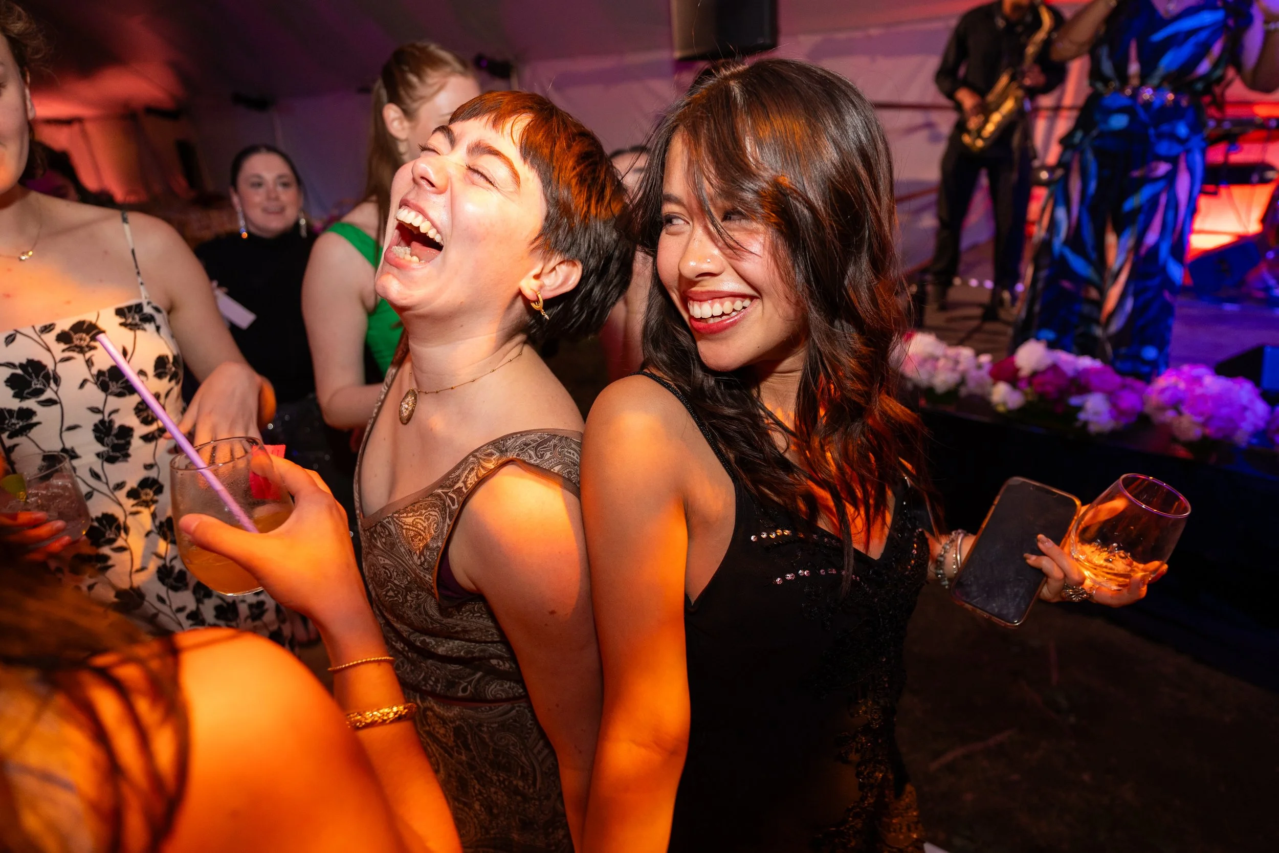 Jess Brown (left) and Shaye Hazen (right) laugh and dance together during the 2026 Season Opening Gala on June 20, 2026.