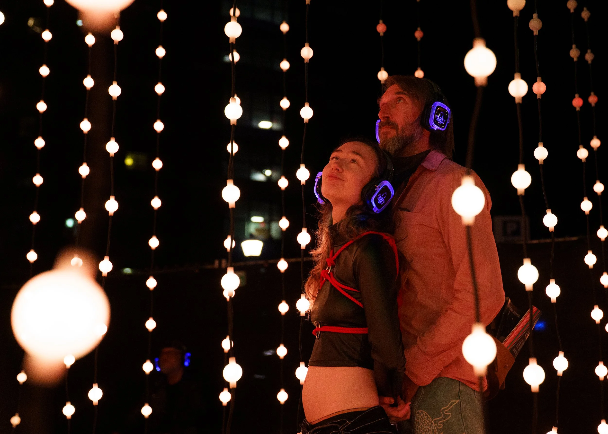 Alex Shepherd and her partner Hans Rasschaerd share an intimate moment together at “Submergence”, the large immersive walk-through experience at Rochester Fringe Festival on September 9, 2025 in Rochester, N.Y. 