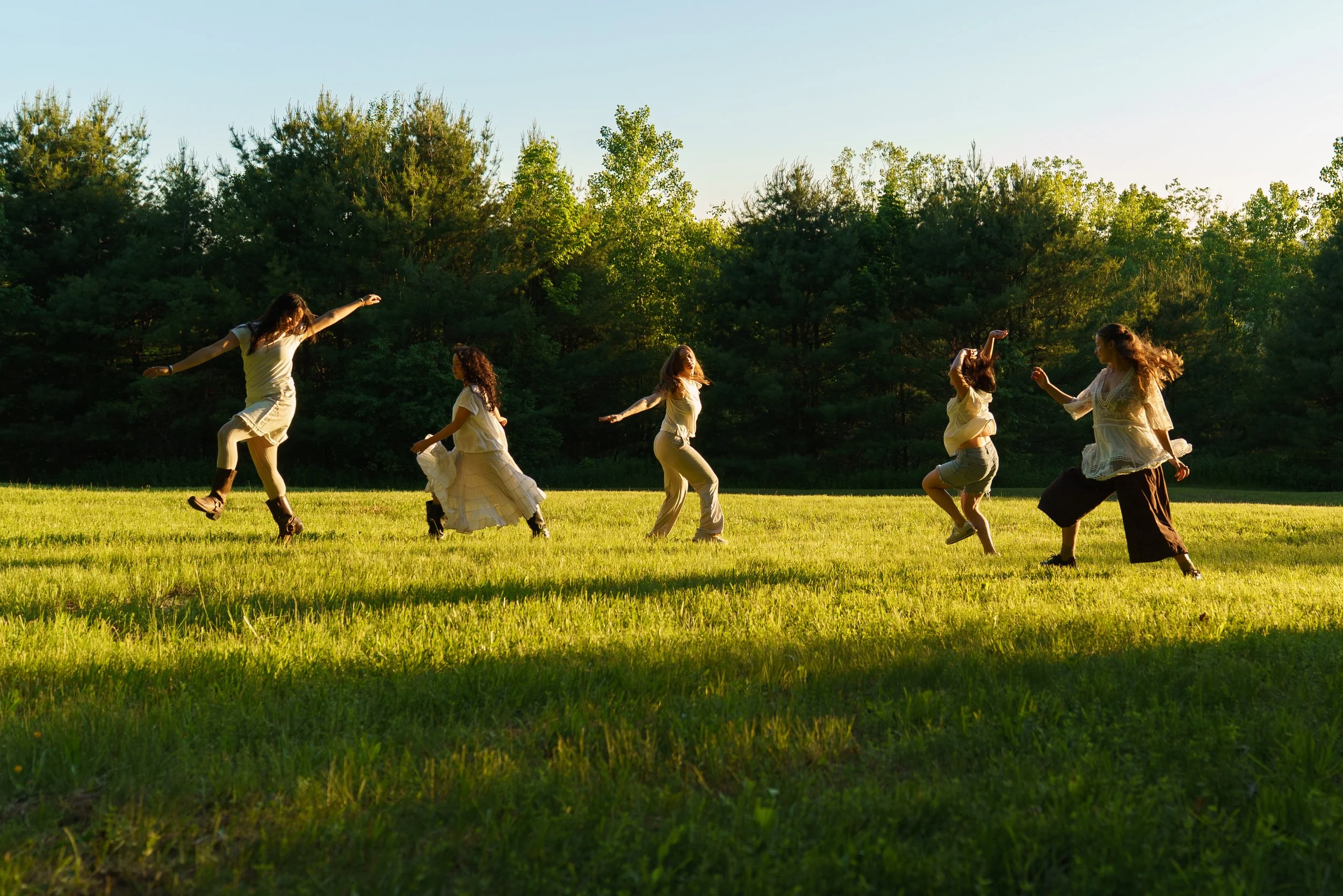 (From left) Shaye Hazen, Tamarah Minami, Elizabeth Buchheister, Gianna Dobrich, and Jenna Eckenrod all jump and skip for Video Documentation Intern Delaney Gondo’s dance music video on June. 9, 2026.