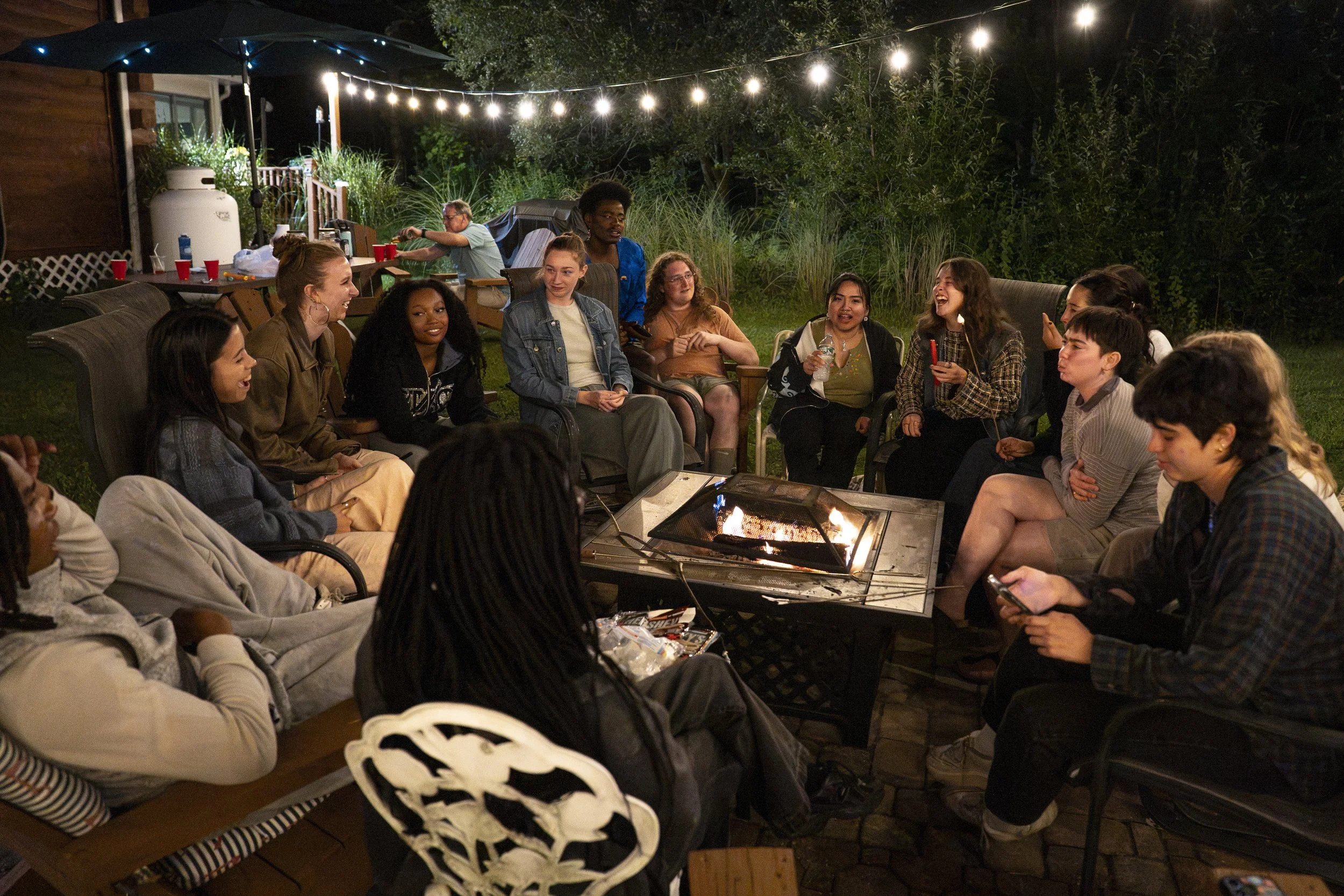 Interns gather to make s’mores and celebrate Jenna Eckenrod’s birthday by lighting two pillar candles that they found on Aug. 10, 2026