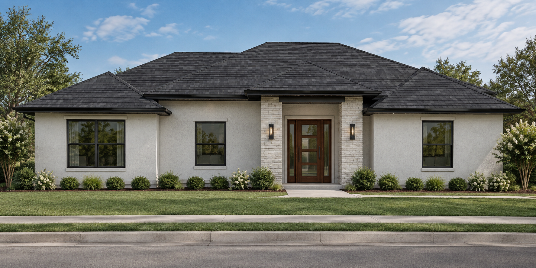 Modern single-story house with white stucco walls, dark shingle roof, and front porch with wooden door, surrounded by green lawn and shrubs, trees in background, cloudy blue sky.