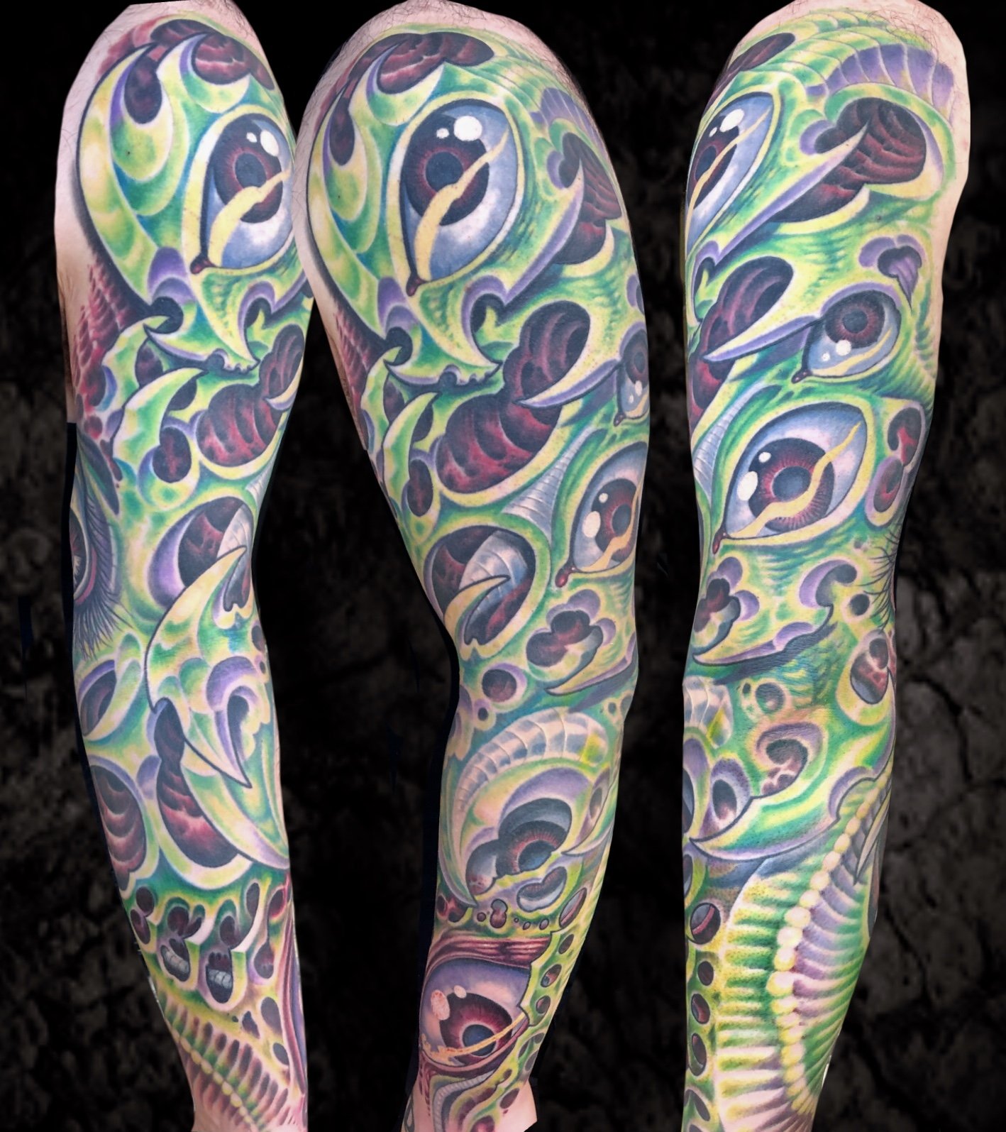Close-up of three arms with vibrant, detailed tattoo sleeves featuring surreal, abstract eye and snake patterns in green, purple, yellow, and red colors.
