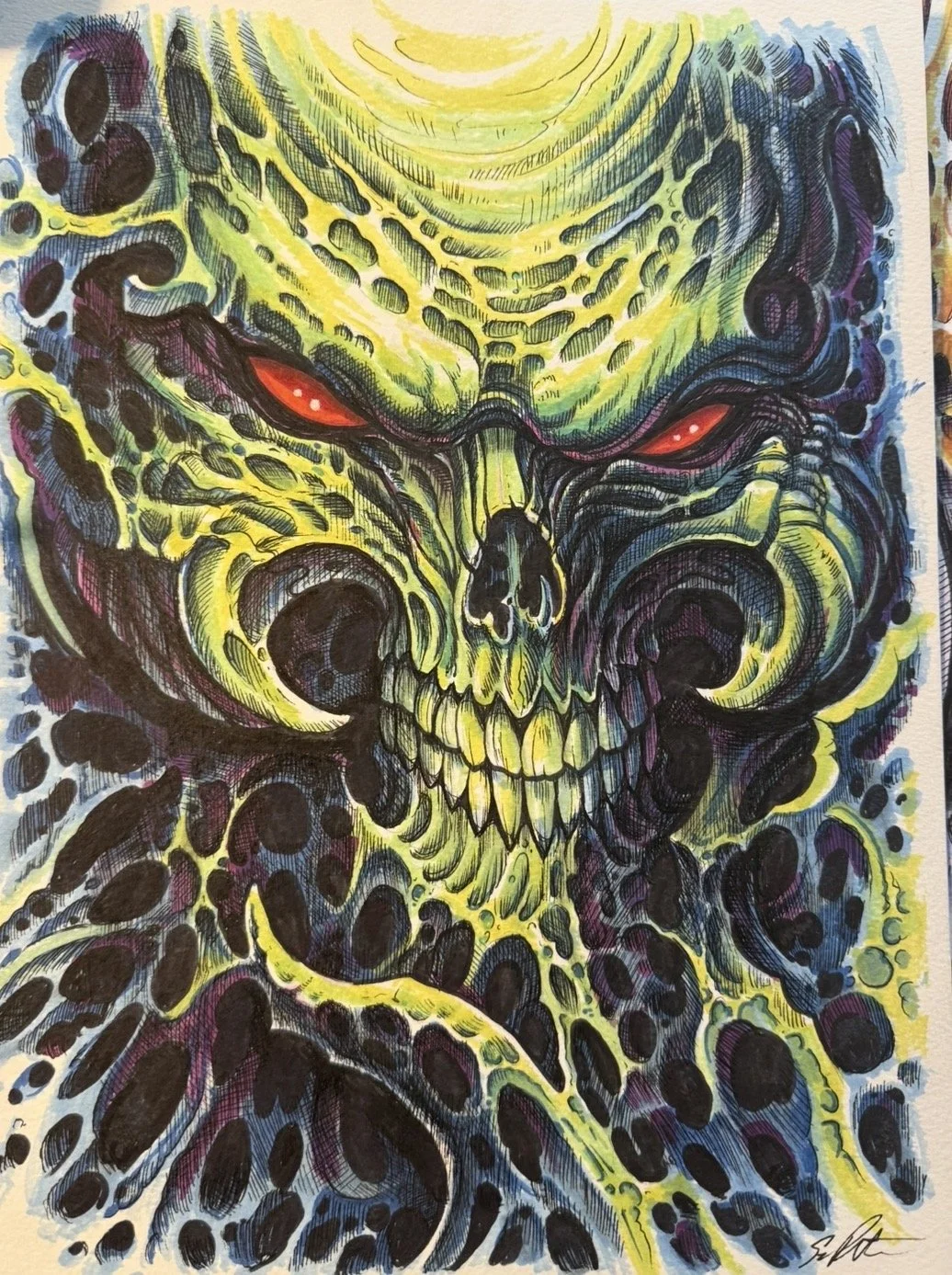 A detailed, colorful illustration of a sinister skull with glowing red eyes, surrounded by abstract patterns in yellow, green, and dark shades, creating a menacing and intense atmosphere.