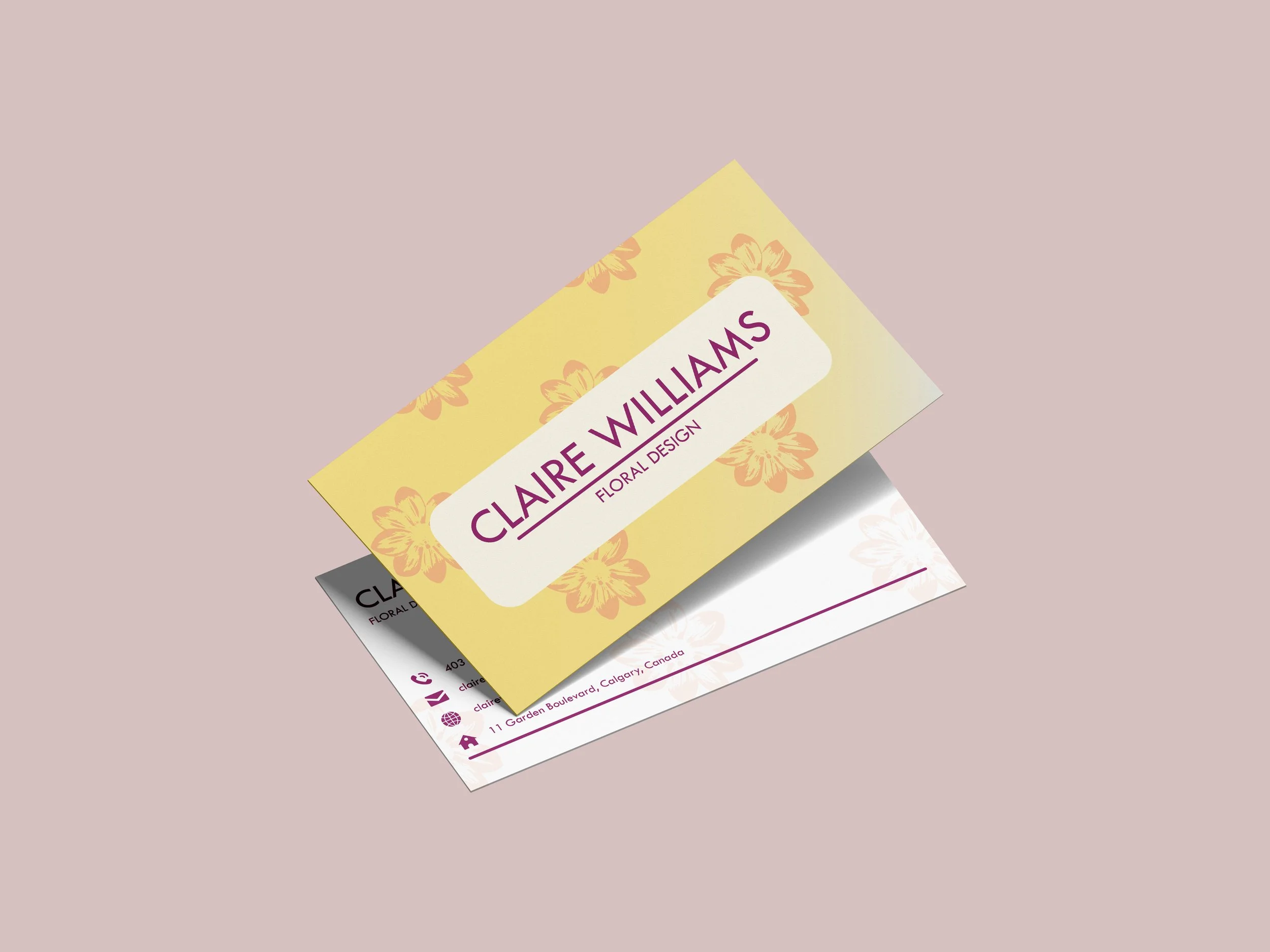 Two business cards, one with a yellow floral background and the other with a white background, featuring contact information and a logo, are layered and partially visible against a pale pink background.