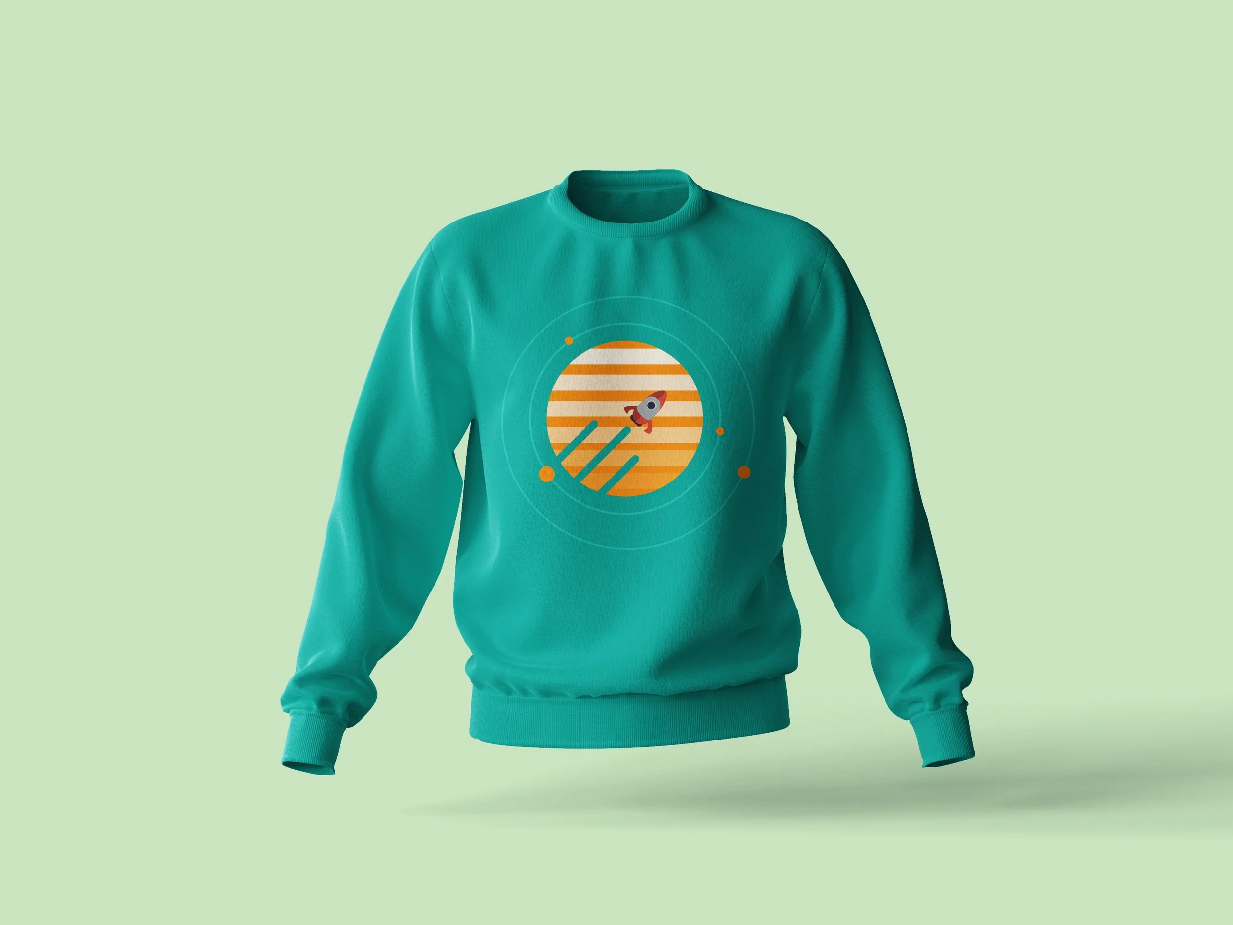 Teal sweatshirt with a circular graphic featuring a rocket ship and orange and white stripes on a light green background.