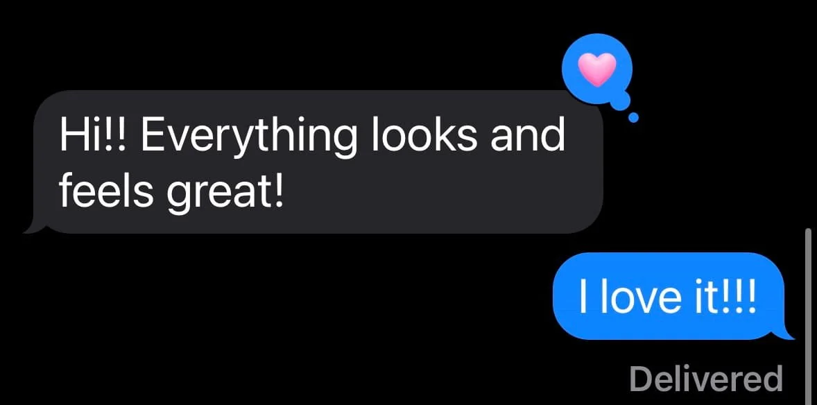 Text message conversation on a phone screen showing a positive message about feeling great and one person expressing love.
