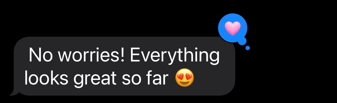 Text message saying, 'No worries! Everything looks great so far' with a smiling face emoji, and a blue chat bubble with a pink heart icon.