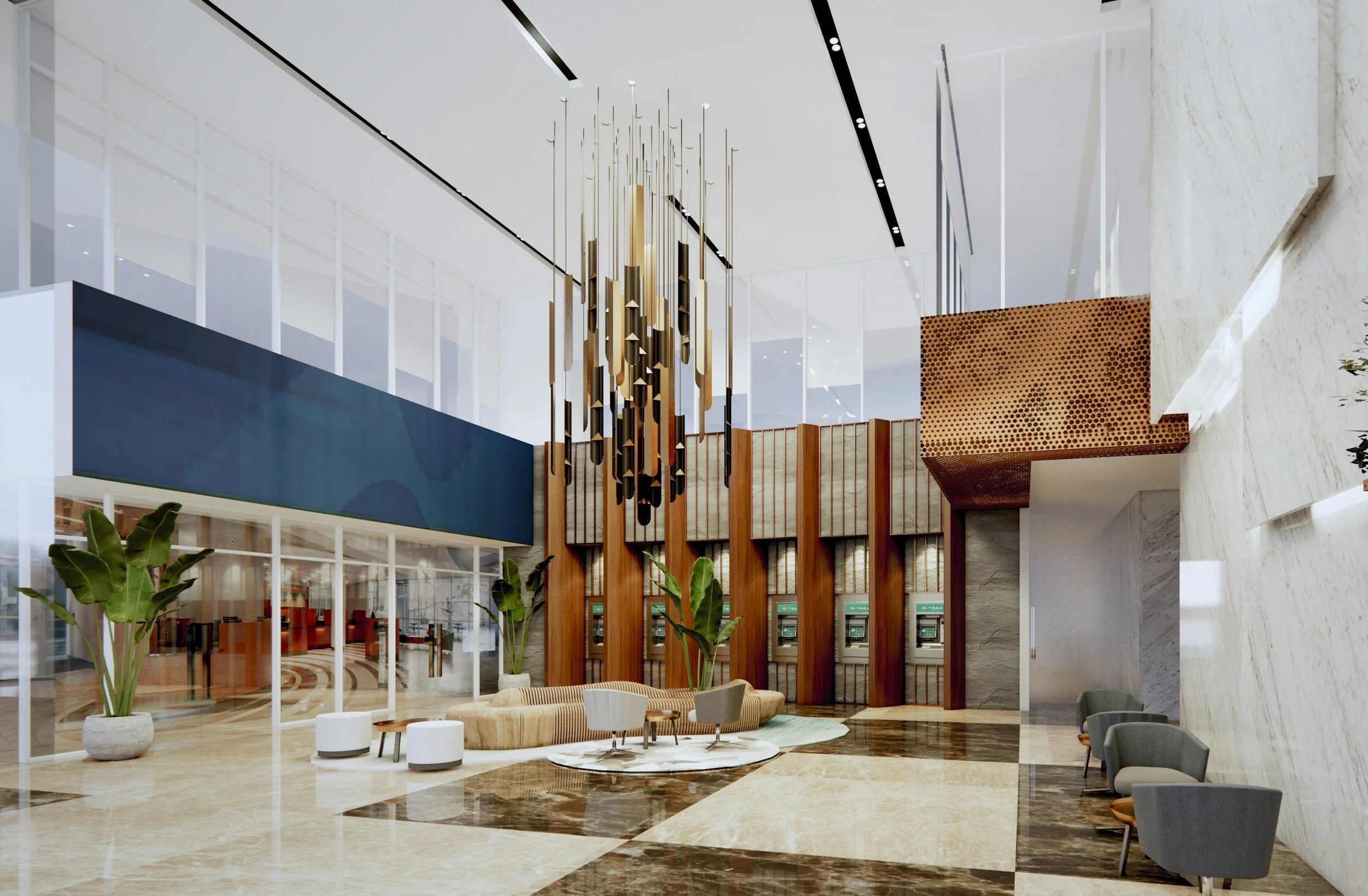 High-ceiling corporate building lobby with modern brass lighting installation
