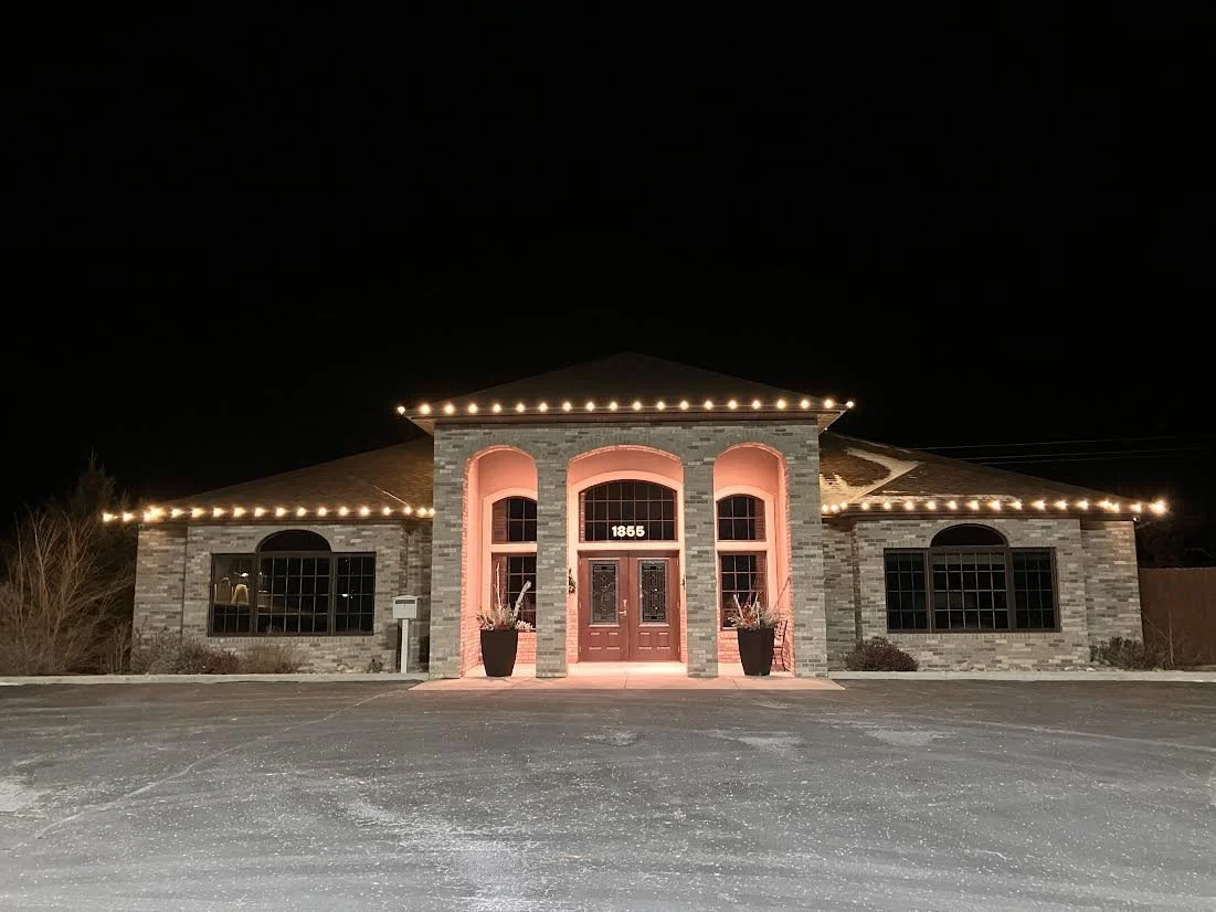 warm white christmas lights on a commercial building entrance.jpg