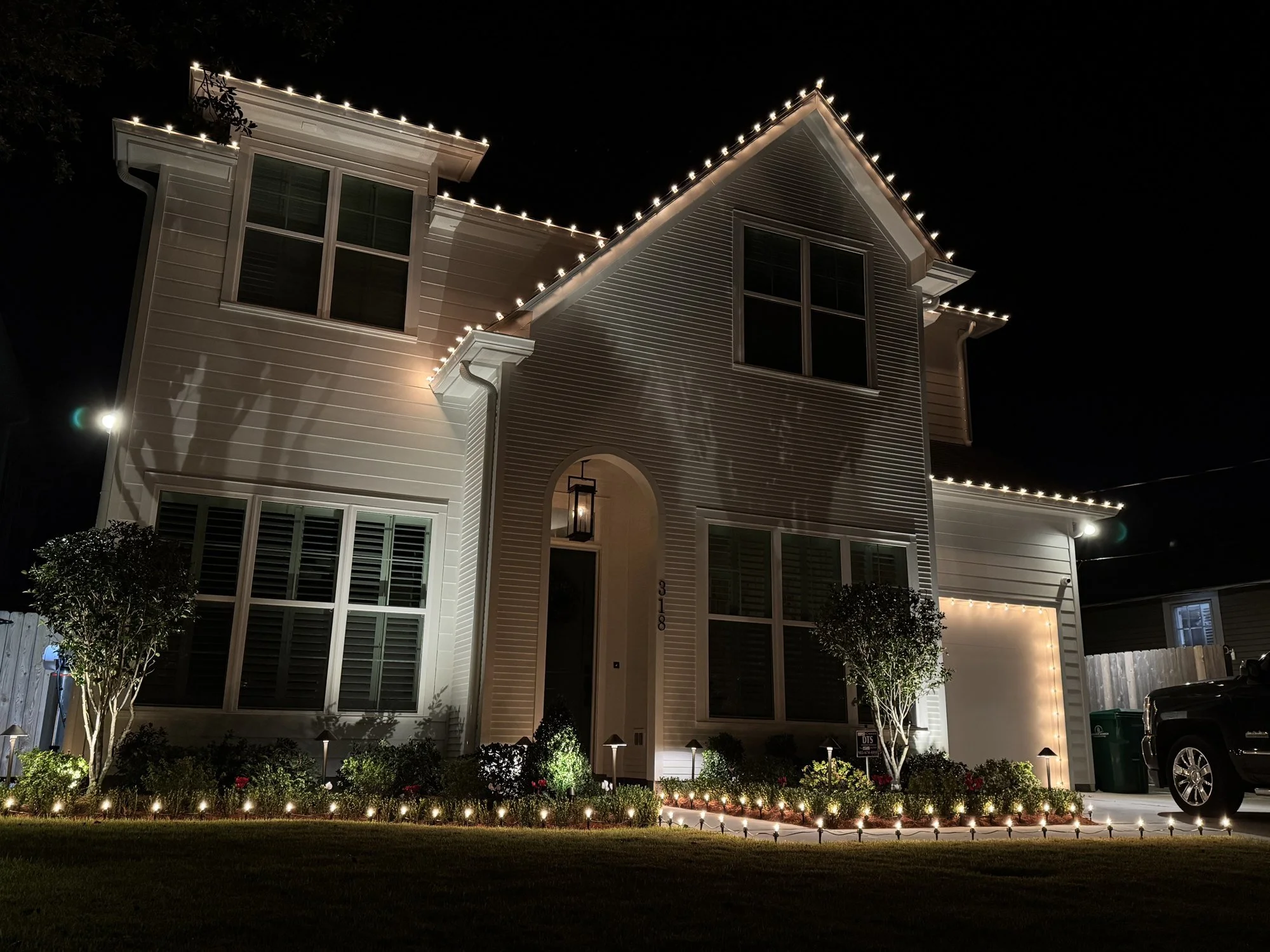 warm-white-christmas-lights-two-story-home.jpg
