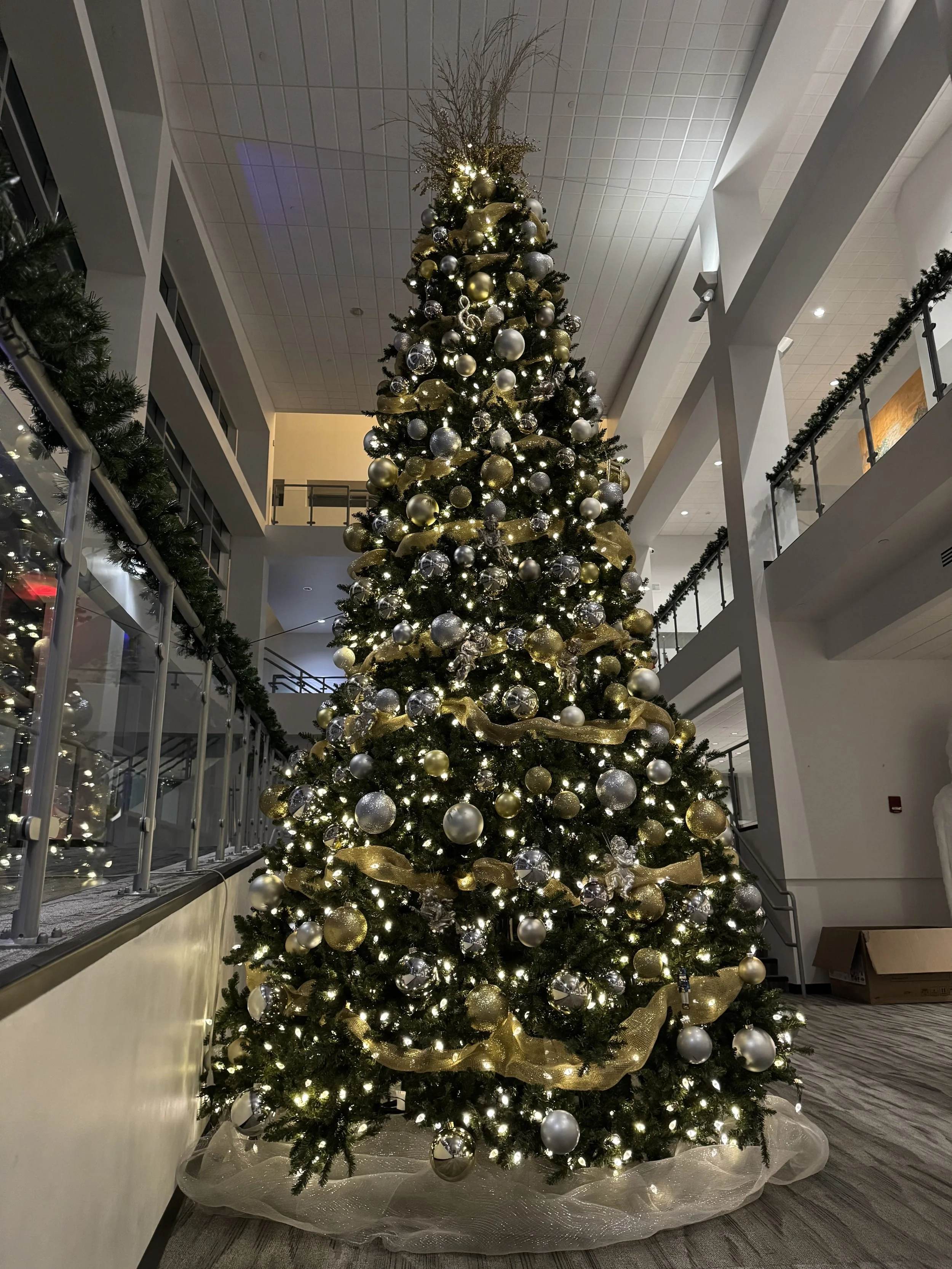 commercial-christmas-tree-silver-gold-ornaments-atrium.jpg