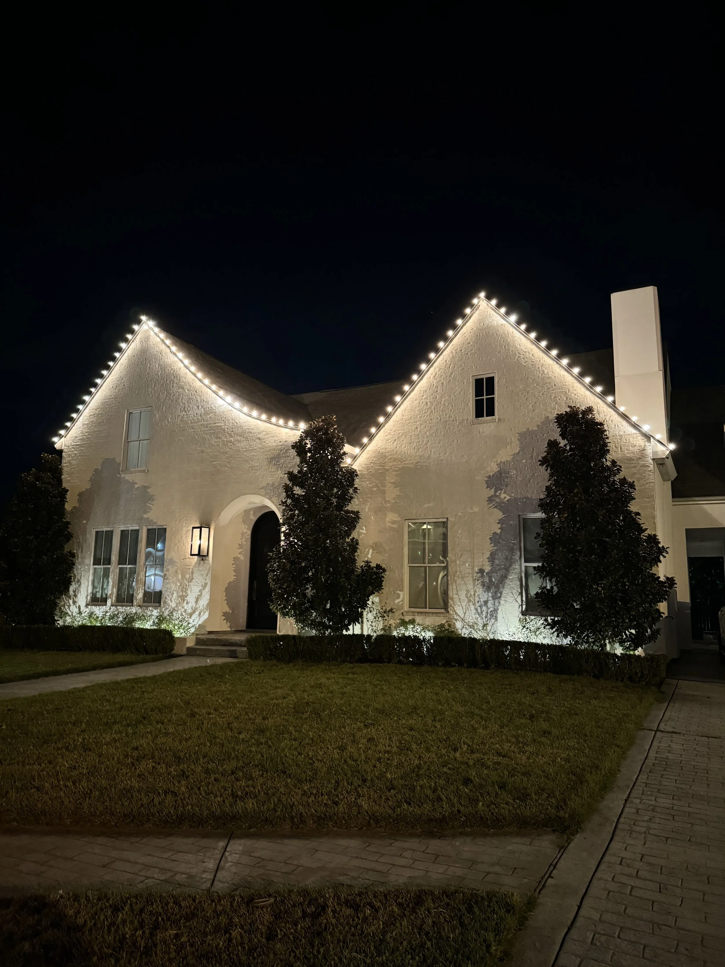 warm-white-christmas-lights-steep-roof-peaks.jpg