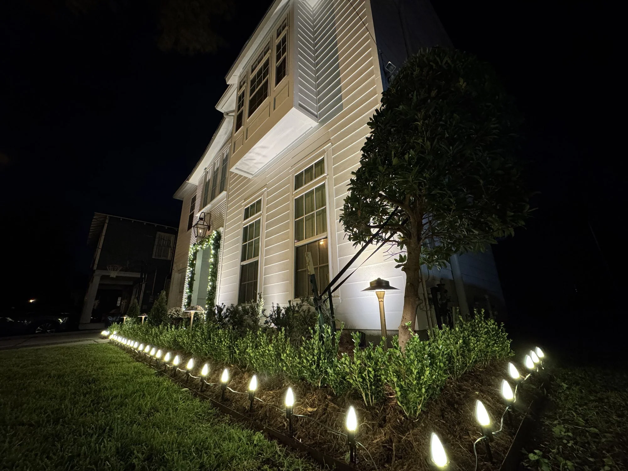 white-christmas-lights-flowerbed-border.jpg
