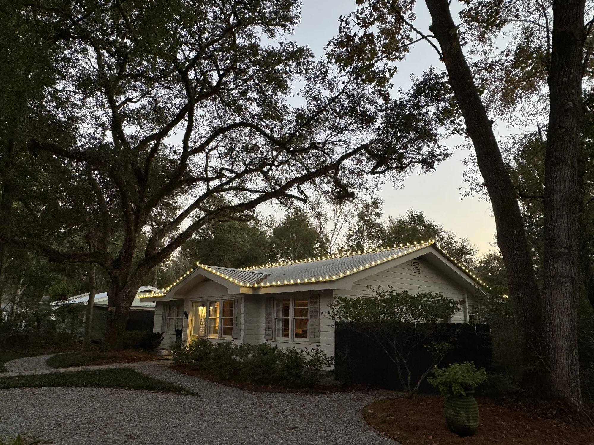warm-white-christmas-lights-house-roofline-at-dusk.jpg