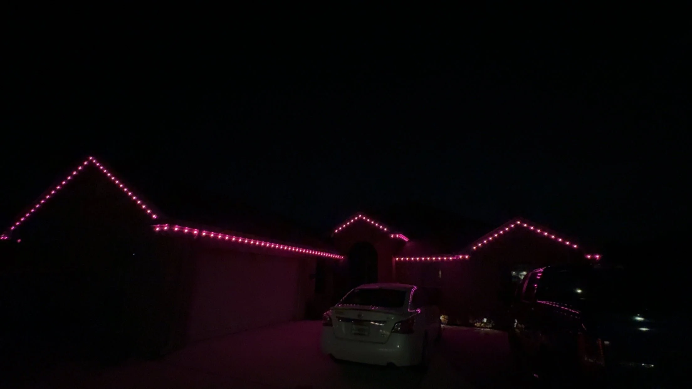 pink-permanent-roofline-lights-at-night.JPG