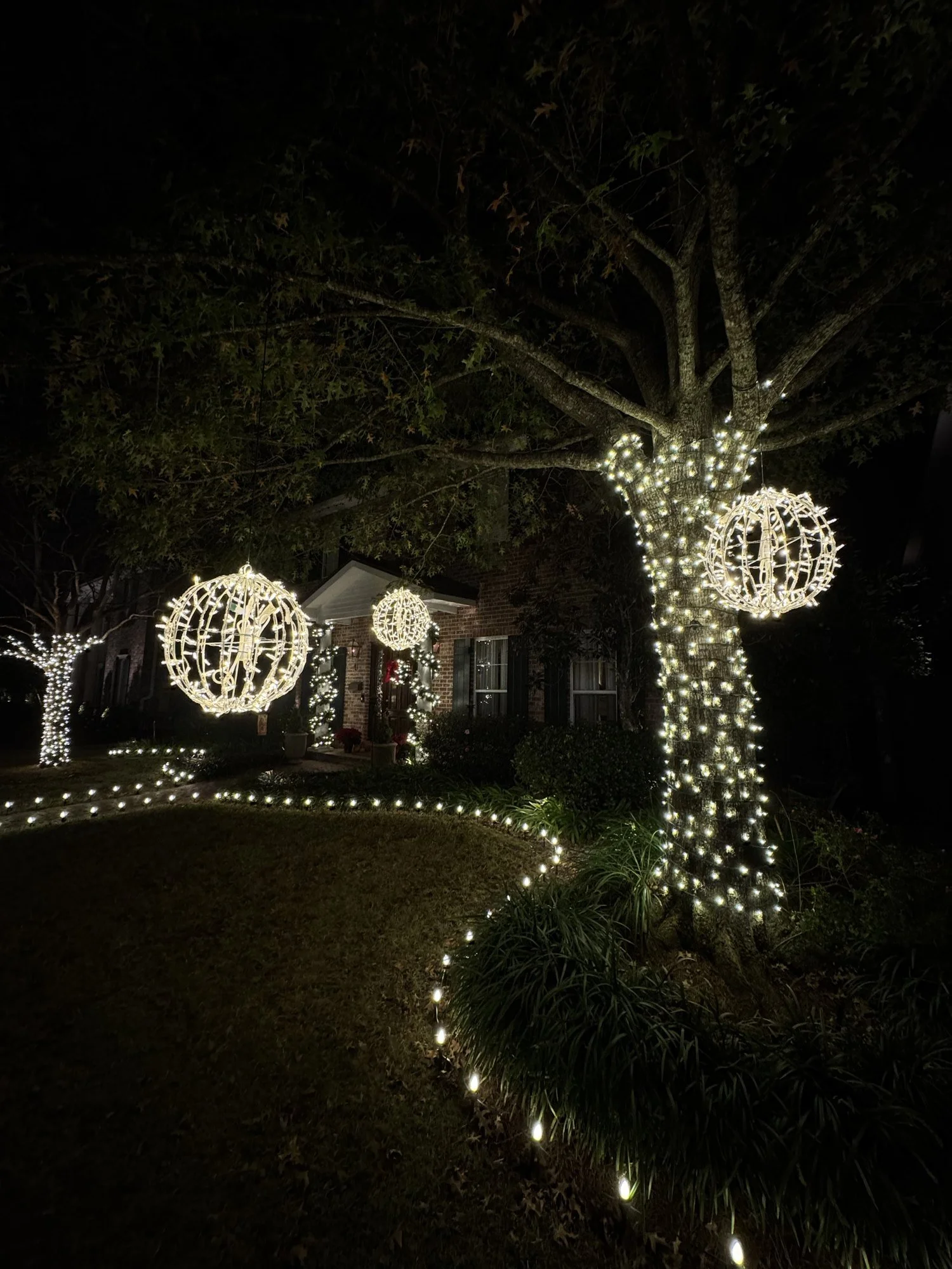white-christmas-lights-tree-and-hanging-spheres.jpg
