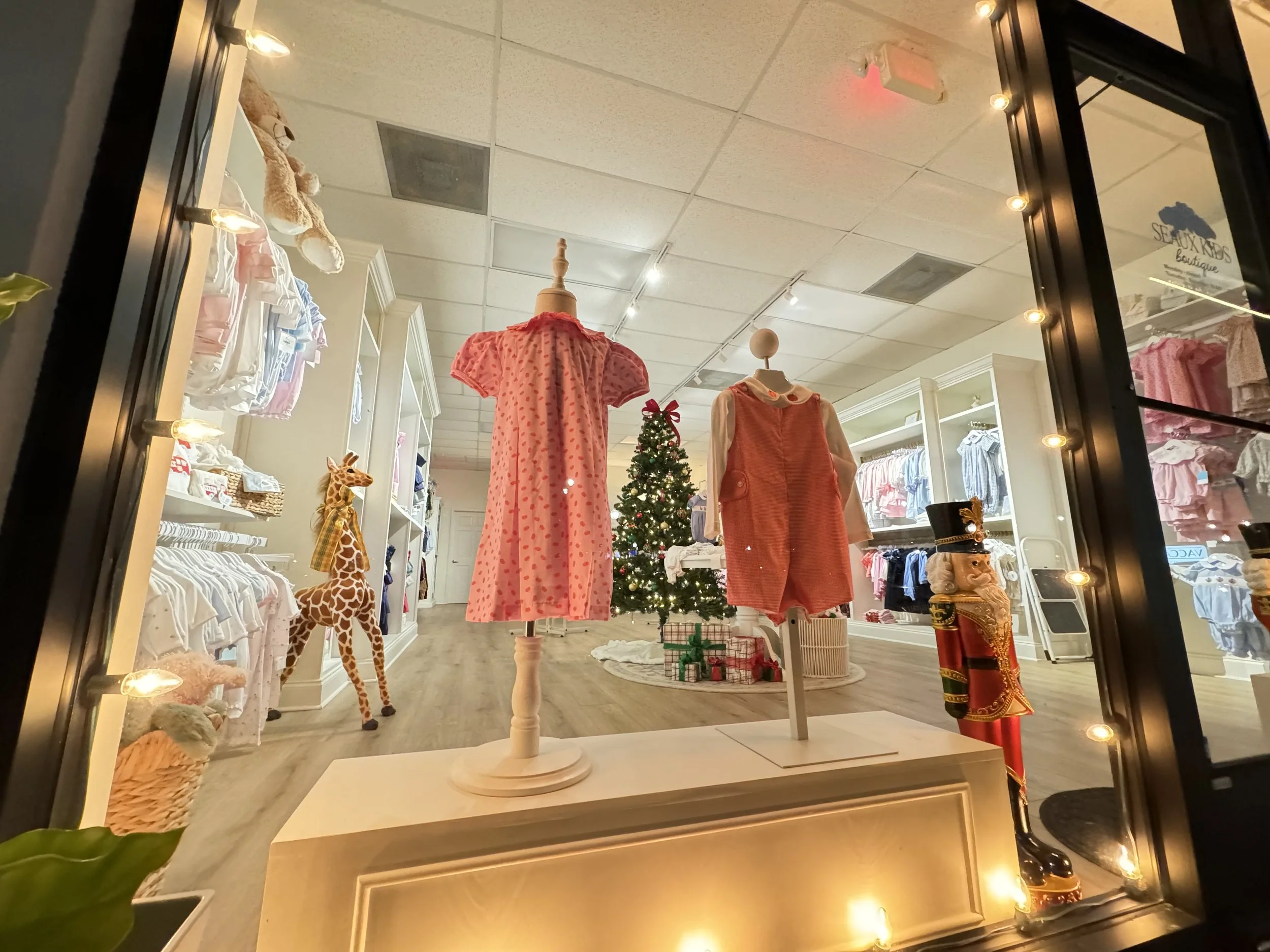 warm-white-lights-framing-childrens-boutique-window-display.jpg