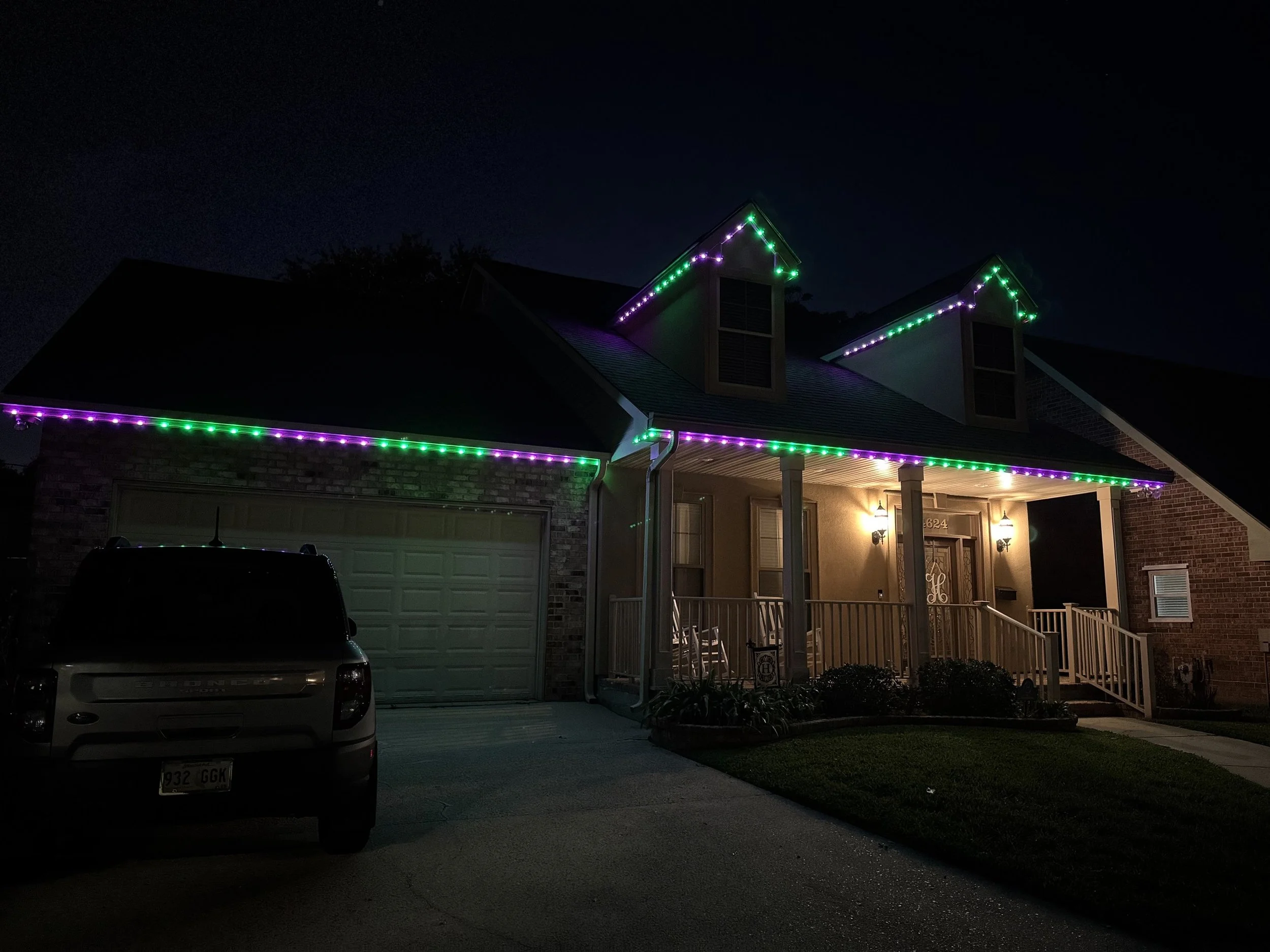 green-purple-permanent-outdoor-lighting-brick-house.jpeg