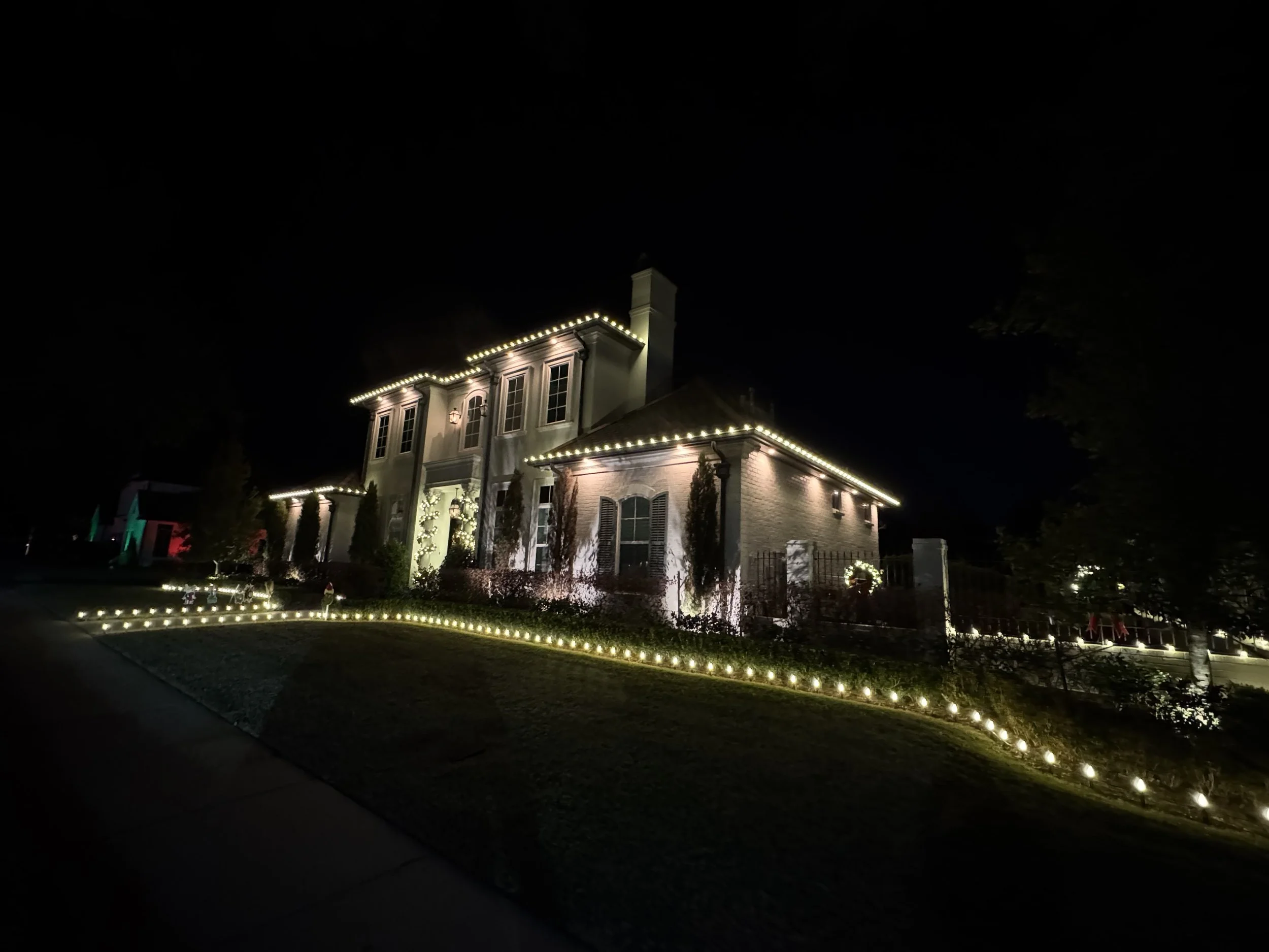 white-christmas-lights-two-story-house-side-view.jpg